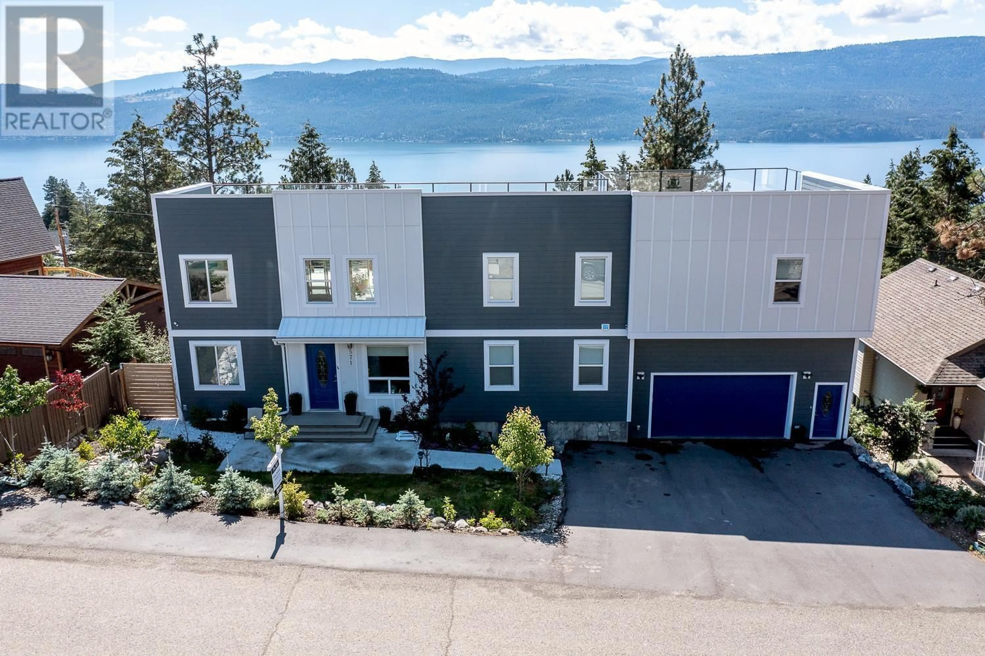 A pic from outside/outdoor area/front of a property/back of a property/a pic from drone, water/lake/river/ocean view for 571 Mountain Drive, Vernon British Columbia V1H2B7