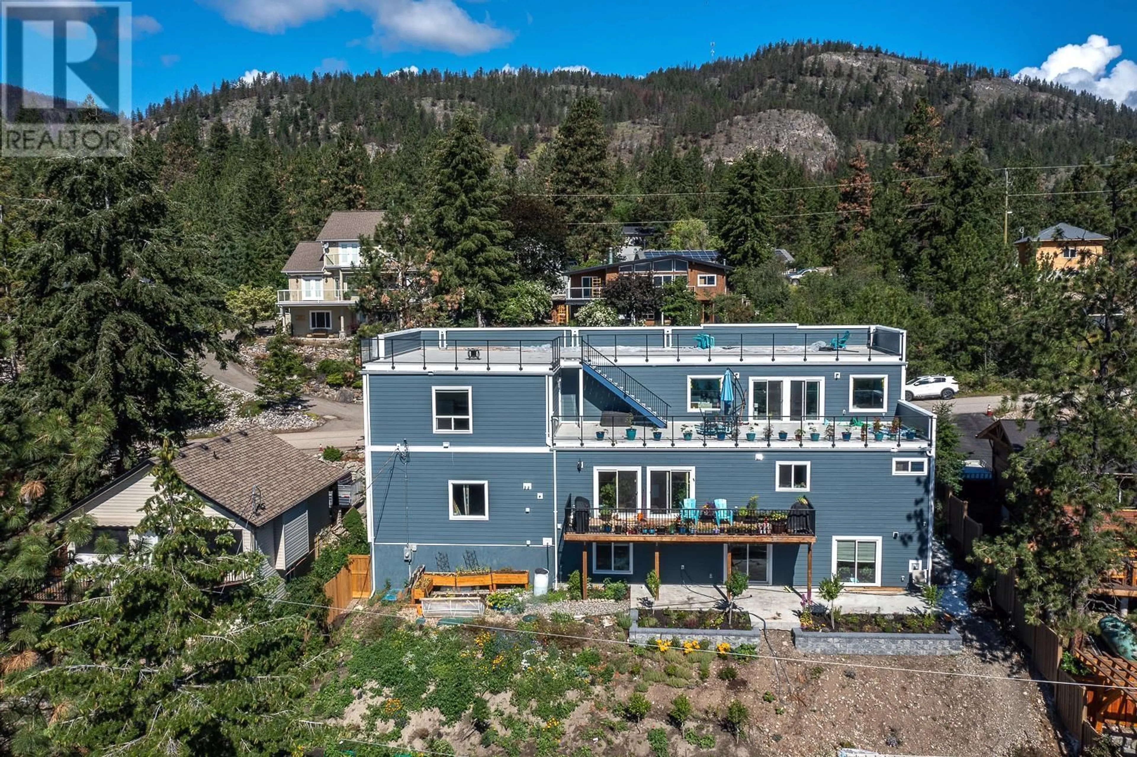 A pic from outside/outdoor area/front of a property/back of a property/a pic from drone, mountain view for 571 Mountain Drive, Vernon British Columbia V1H2B7