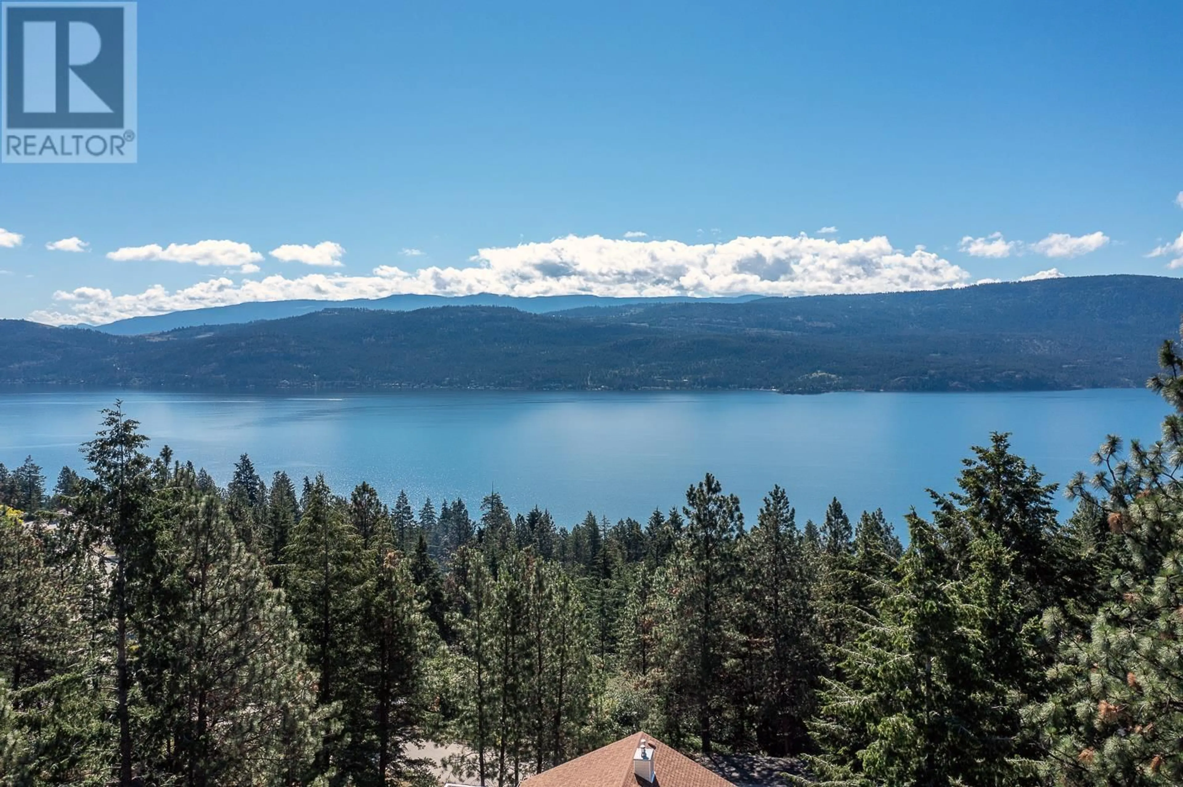 A pic from outside/outdoor area/front of a property/back of a property/a pic from drone, water/lake/river/ocean view for 571 Mountain Drive, Vernon British Columbia V1H2B7