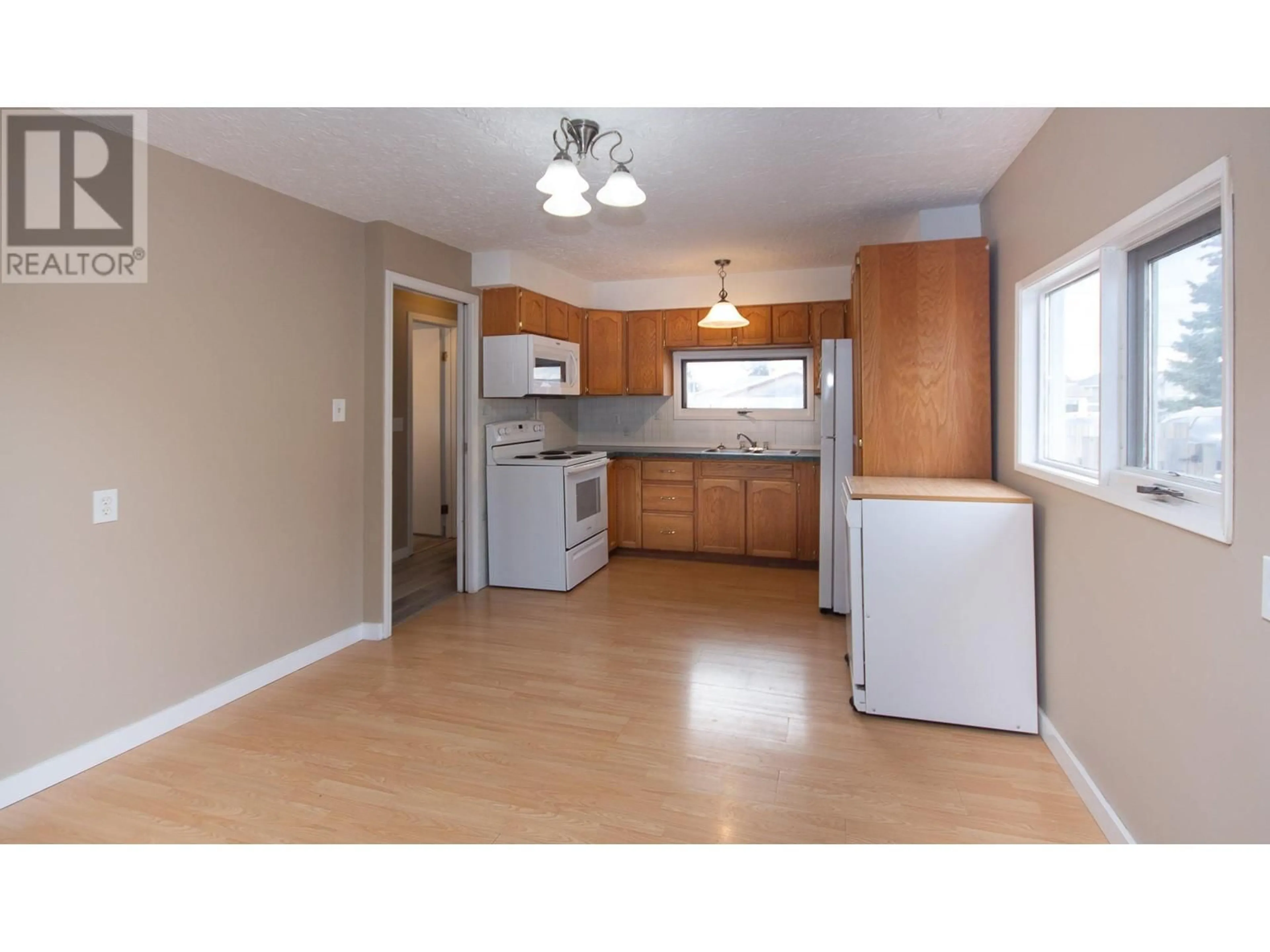 Standard kitchen, wood/laminate floor for 505 96A Avenue, Dawson Creek British Columbia V1G1M5