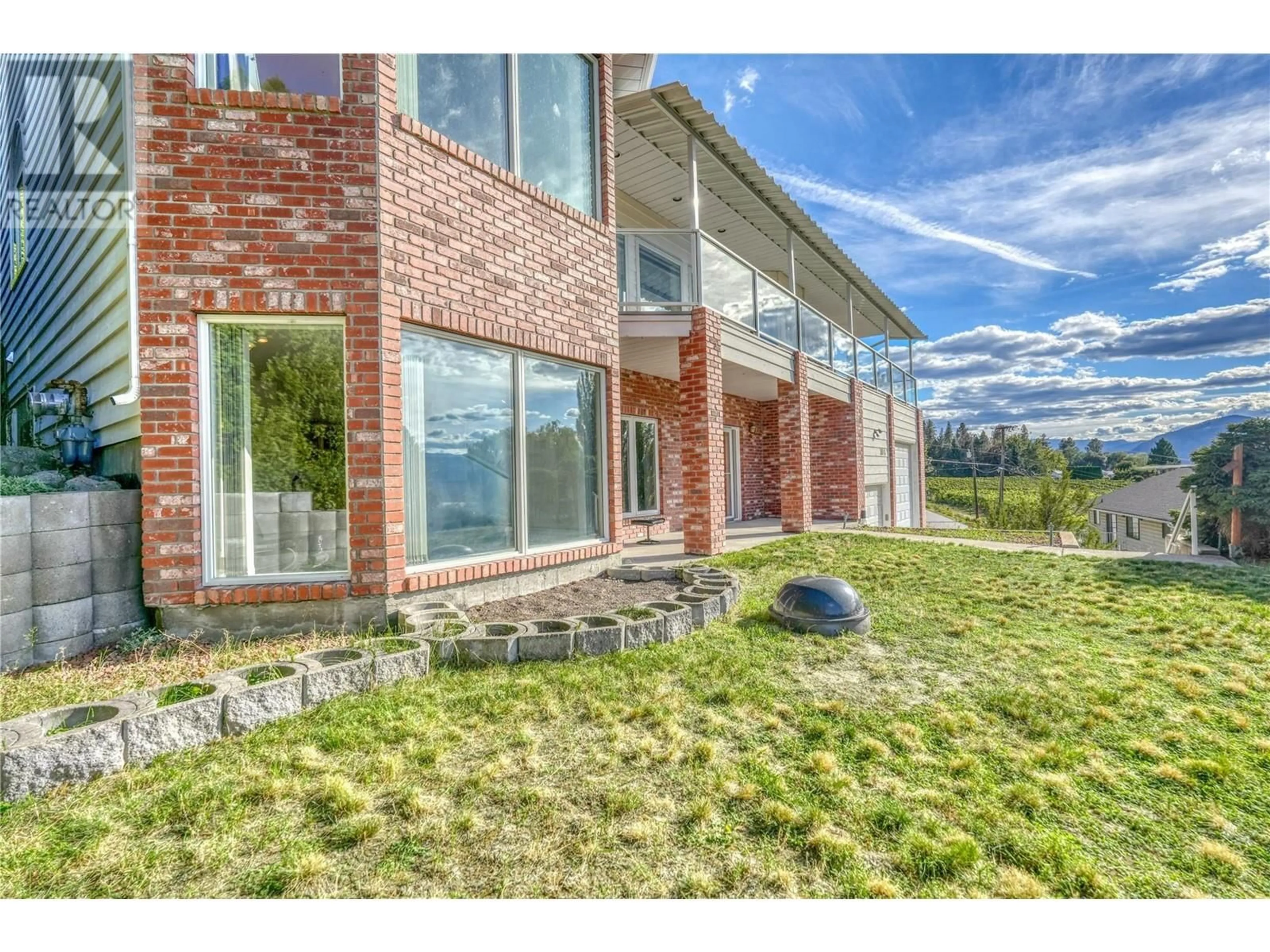 Home with brick exterior material, mountain view for 3018 DEBECK ROAD, Naramata British Columbia V0H1N1