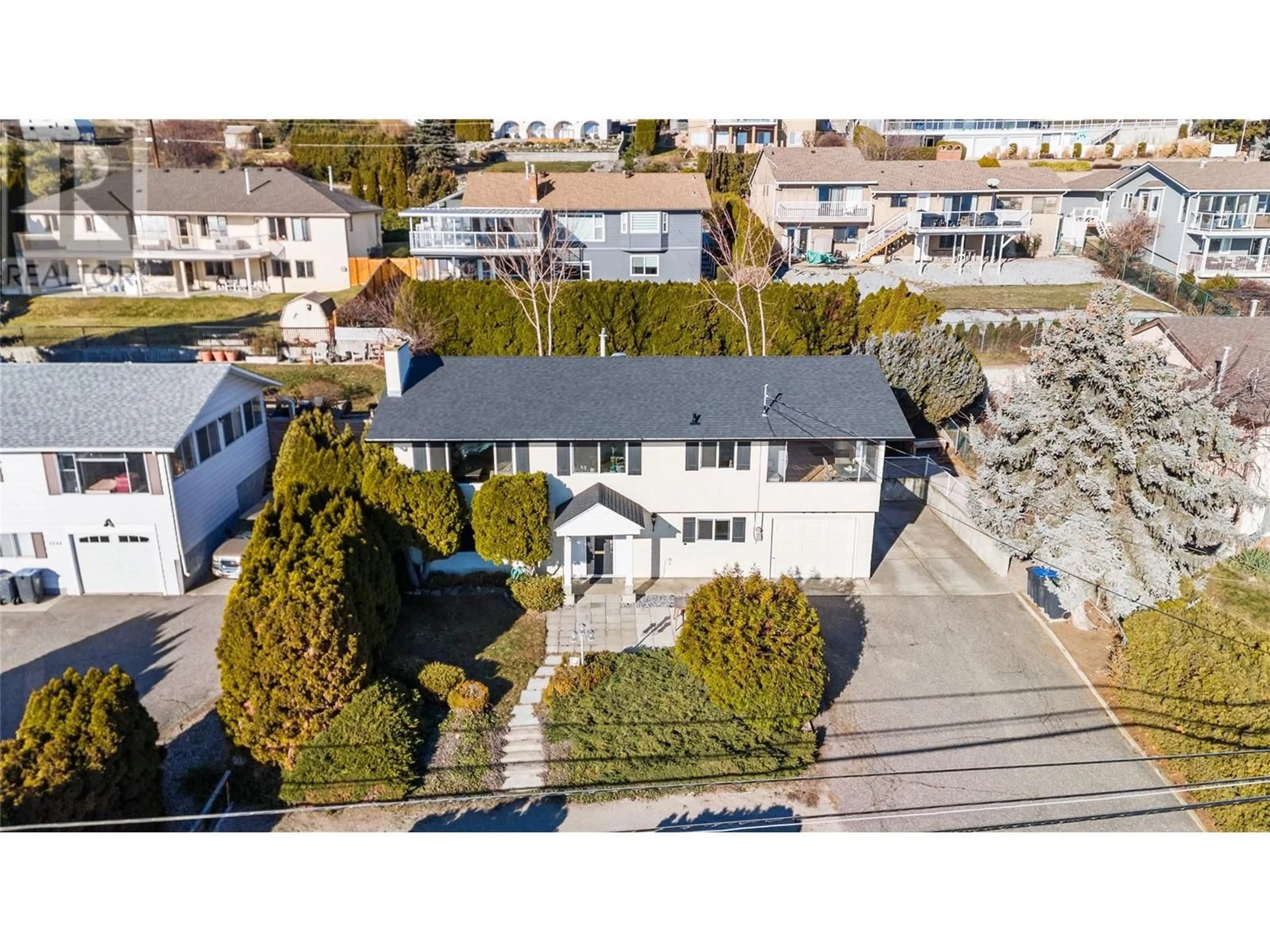 A pic from outside/outdoor area/front of a property/back of a property/a pic from drone, street for 3242 Boucherie Road, West Kelowna British Columbia V1Z2H2