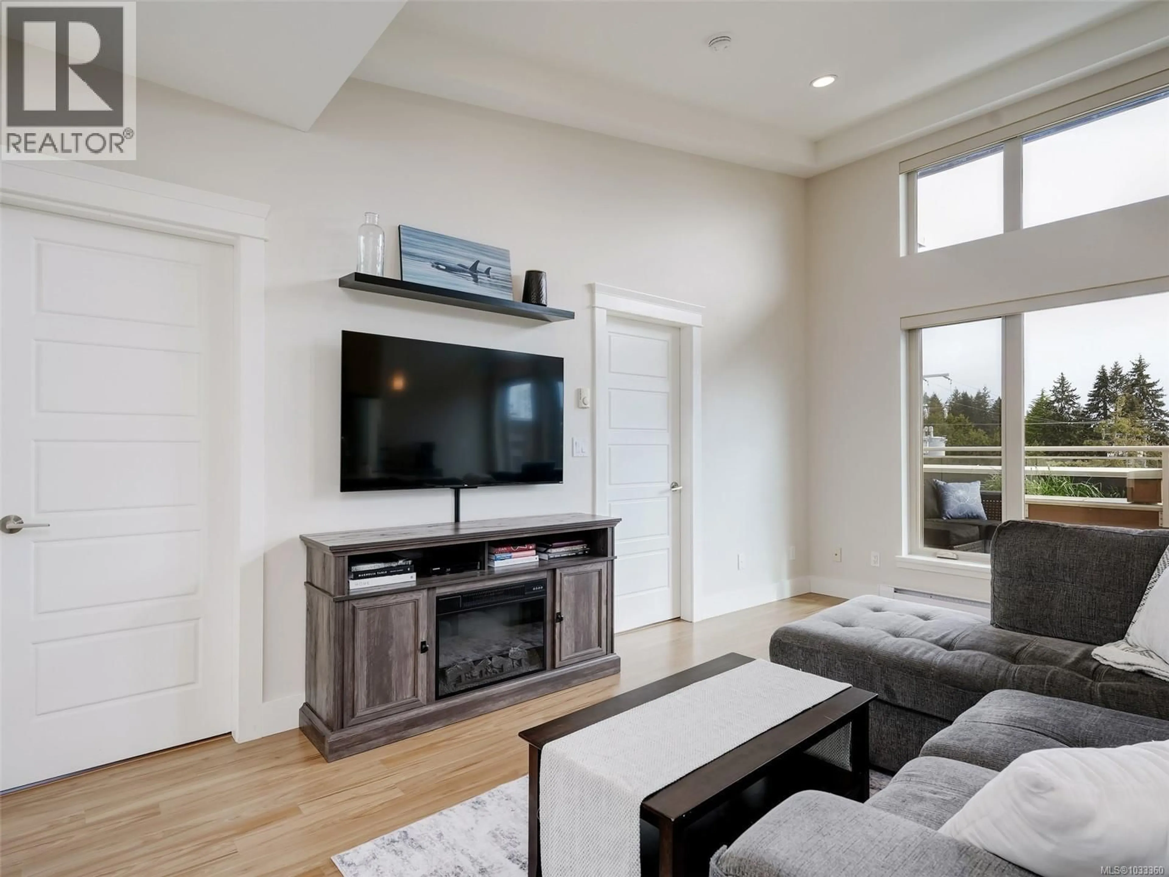 Living room with furniture, unknown for 401 - 7161 WEST SAANICH ROAD, Central Saanich British Columbia V8M1P7