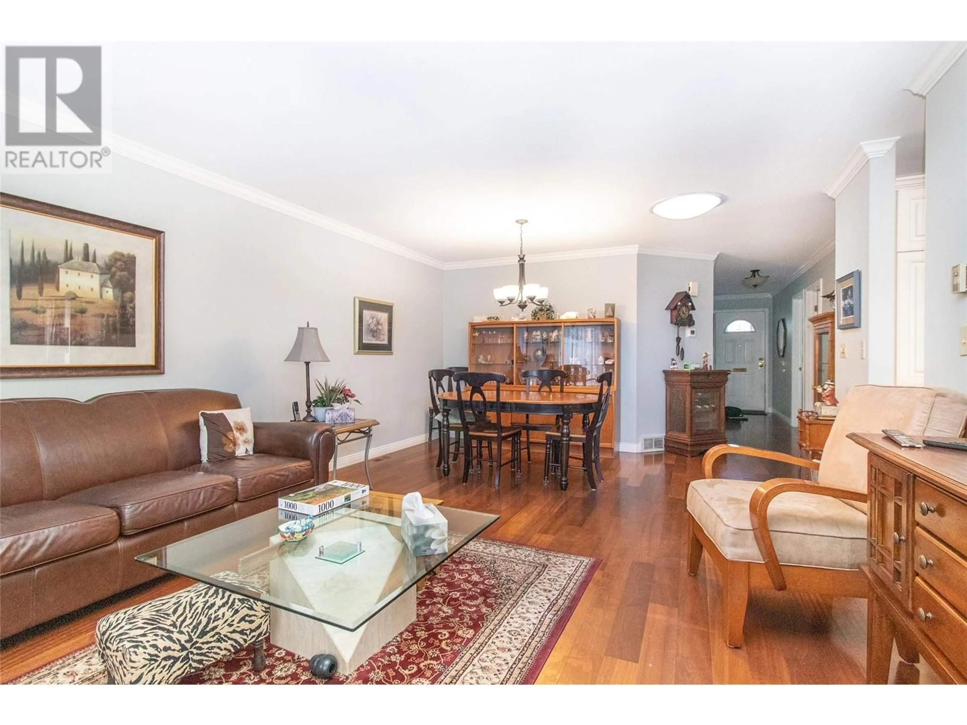 Living room with furniture, wood/laminate floor for 1101 Cameron Avenue Unit# 5, Kelowna British Columbia V1Y8V2