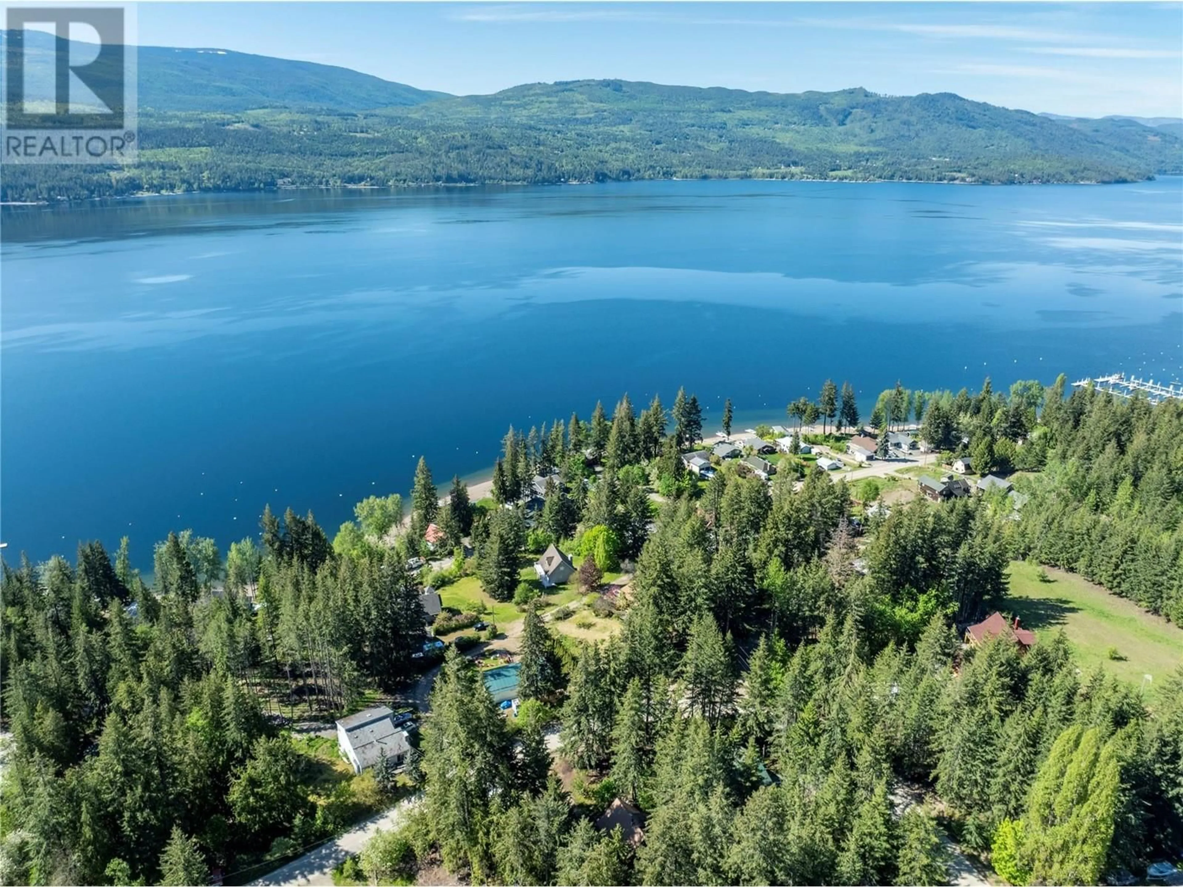A pic from outside/outdoor area/front of a property/back of a property/a pic from drone, water/lake/river/ocean view for 2572 AIRSTRIP ROAD, Anglemont British Columbia V0E1M8