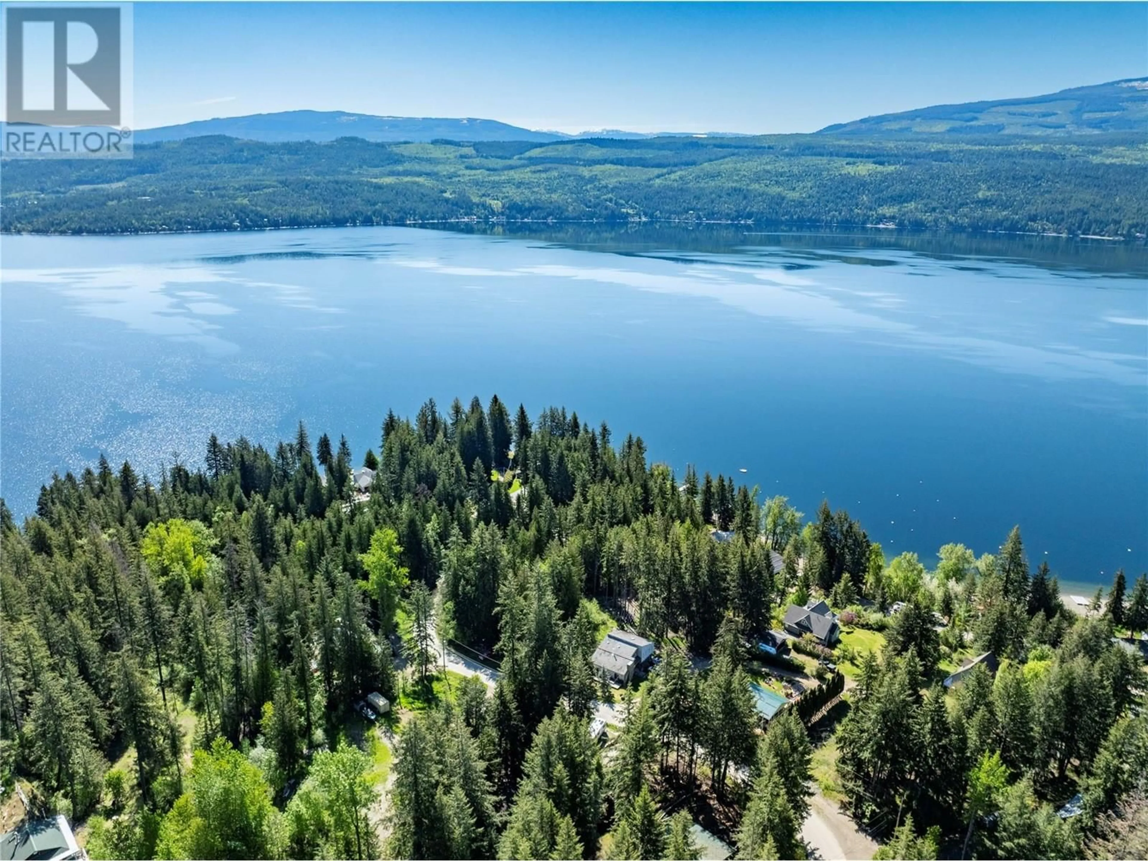 A pic from outside/outdoor area/front of a property/back of a property/a pic from drone, water/lake/river/ocean view for 2572 AIRSTRIP ROAD, Anglemont British Columbia V0E1M8