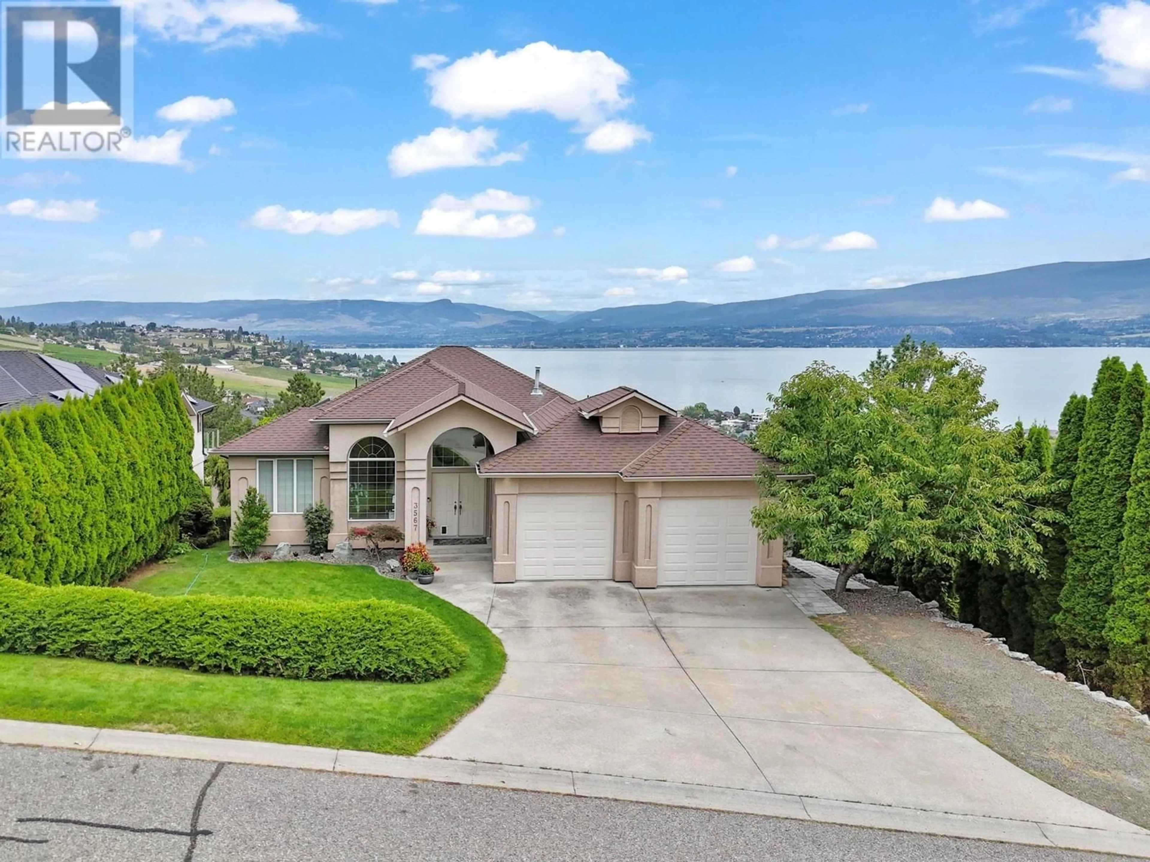 A pic from outside/outdoor area/front of a property/back of a property/a pic from drone, water/lake/river/ocean view for 3567 ROYAL GALA DRIVE, West Kelowna British Columbia V4T2M4