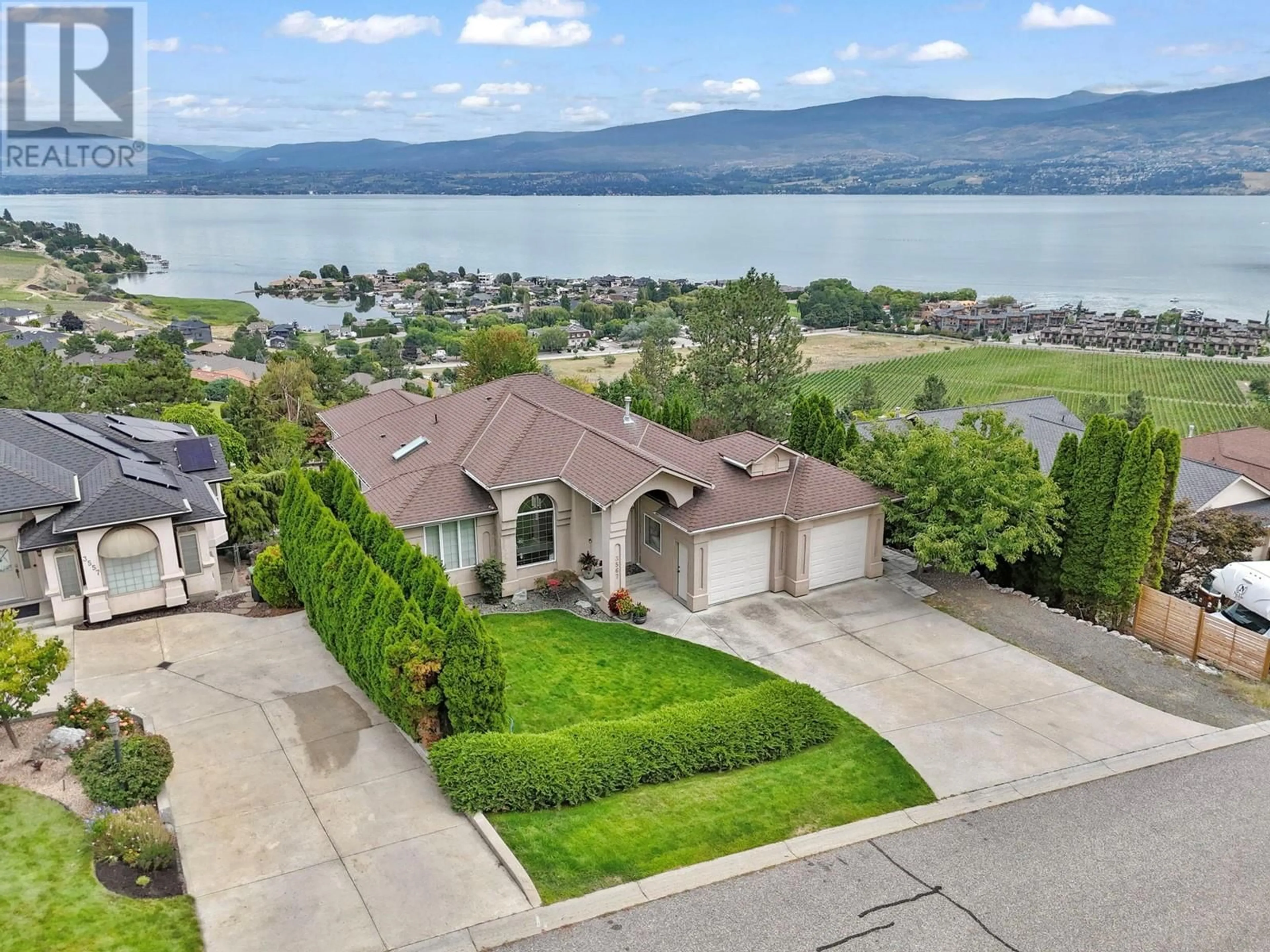 A pic from outside/outdoor area/front of a property/back of a property/a pic from drone, water/lake/river/ocean view for 3567 Royal Gala Drive, West Kelowna British Columbia V4T2M4