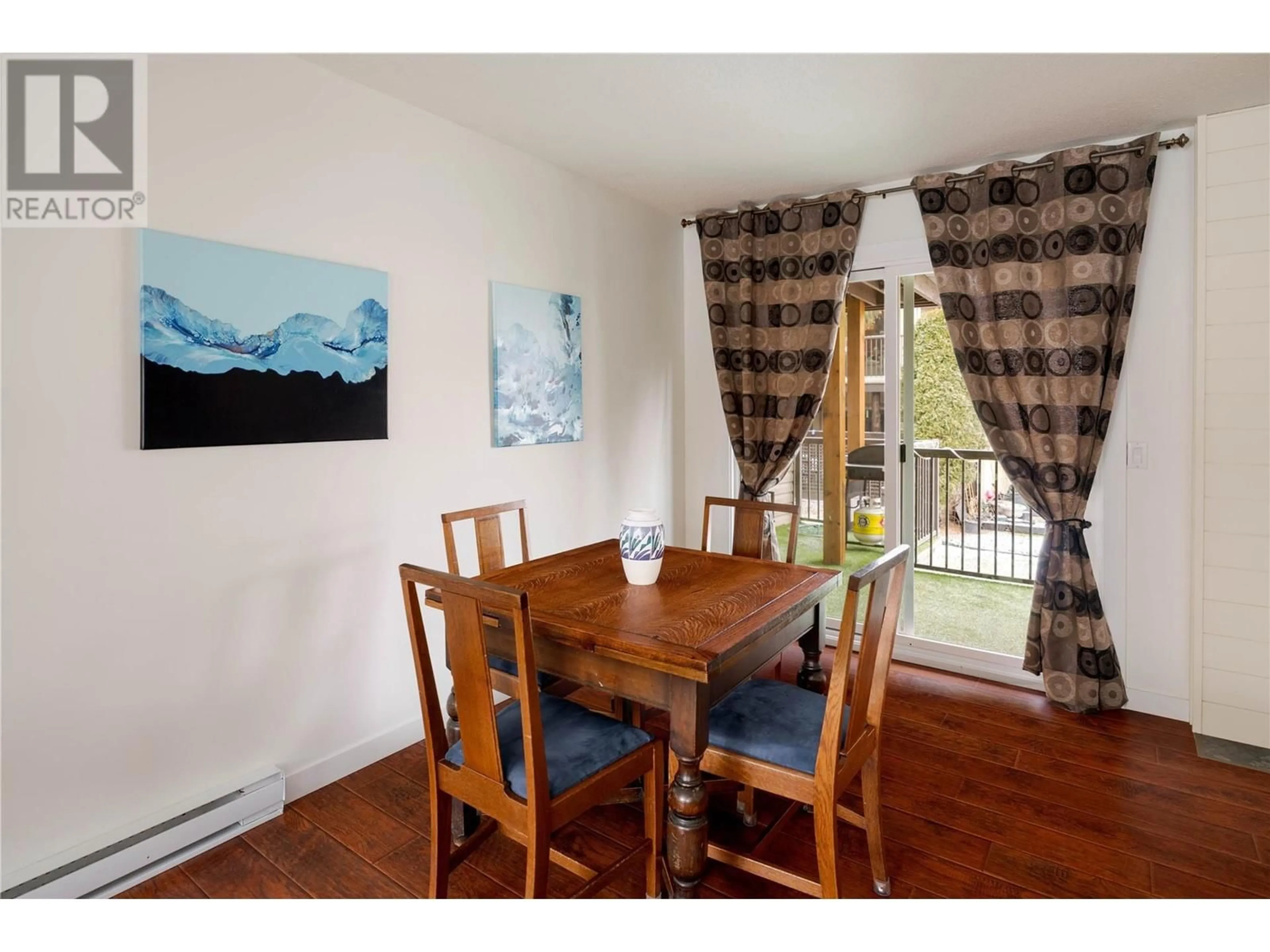 Dining room, wood/laminate floor for 250 Briarwood Road Unit# 117, Kelowna British Columbia V1X2G3