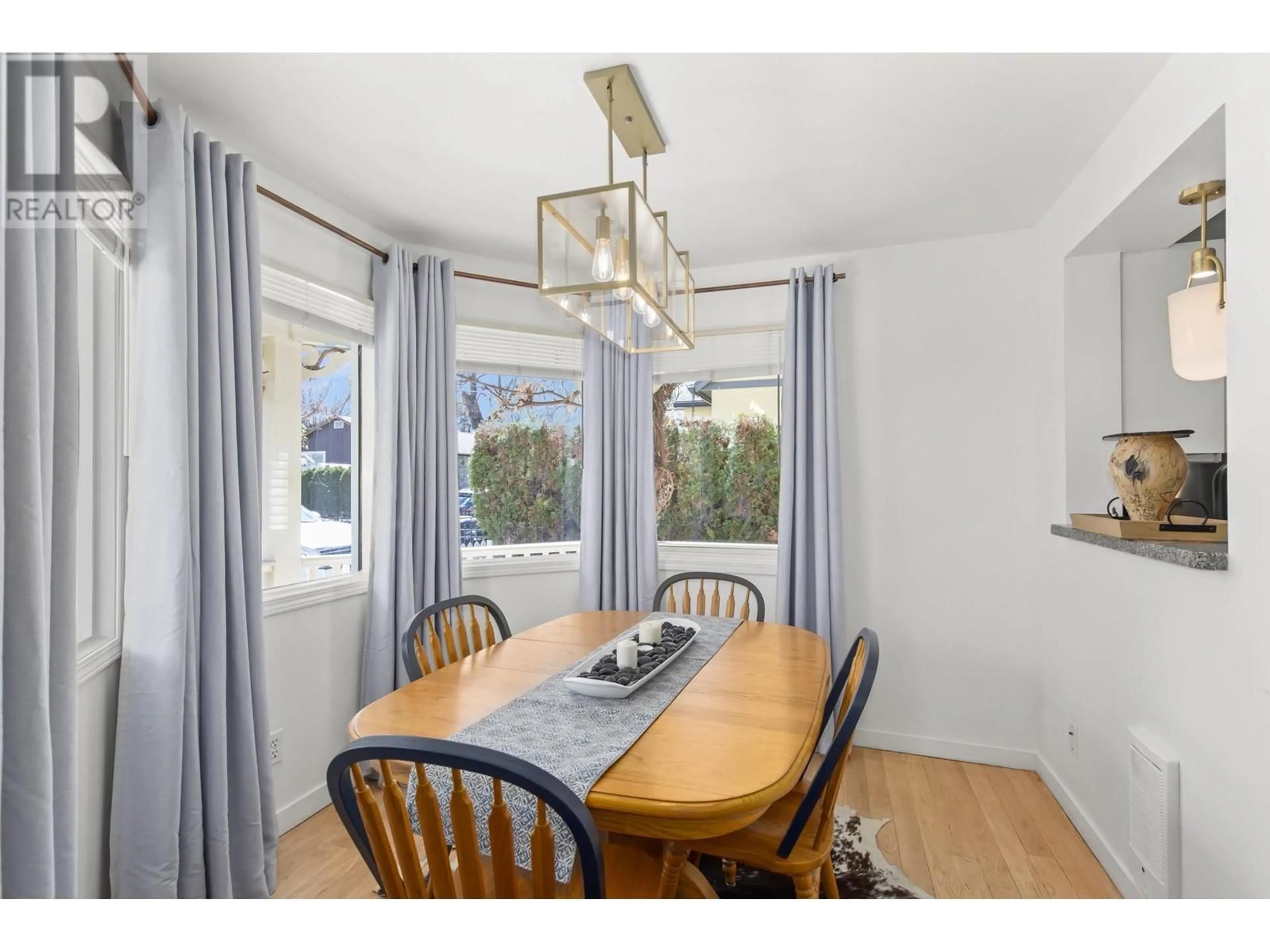 Dining room, wood/laminate floor for 1868 Marshall Street, Kelowna British Columbia V1Y2B7