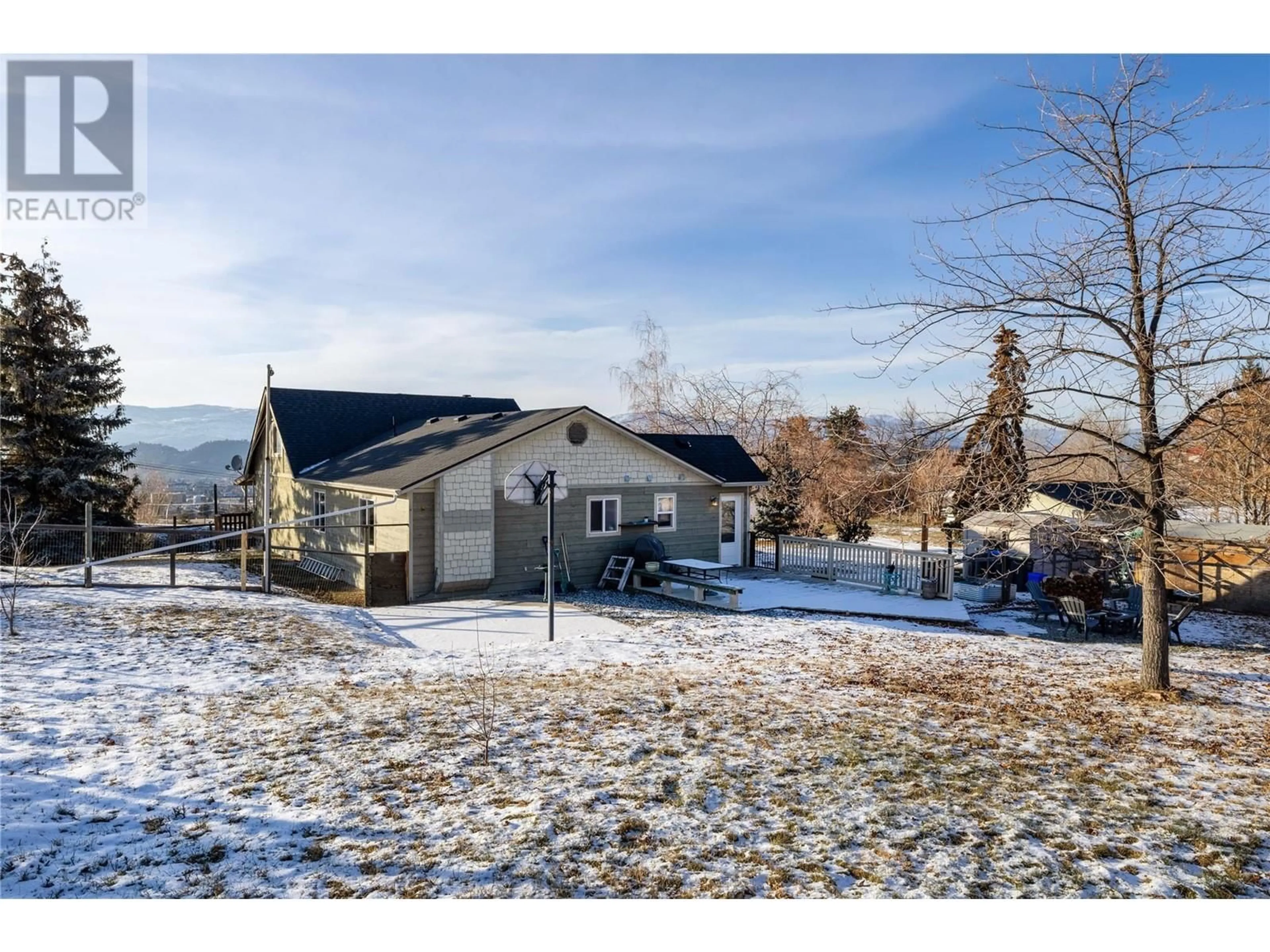 A pic from outside/outdoor area/front of a property/back of a property/a pic from drone, mountain view for 1155 Mckenzie Road, Kelowna British Columbia V1P1C3