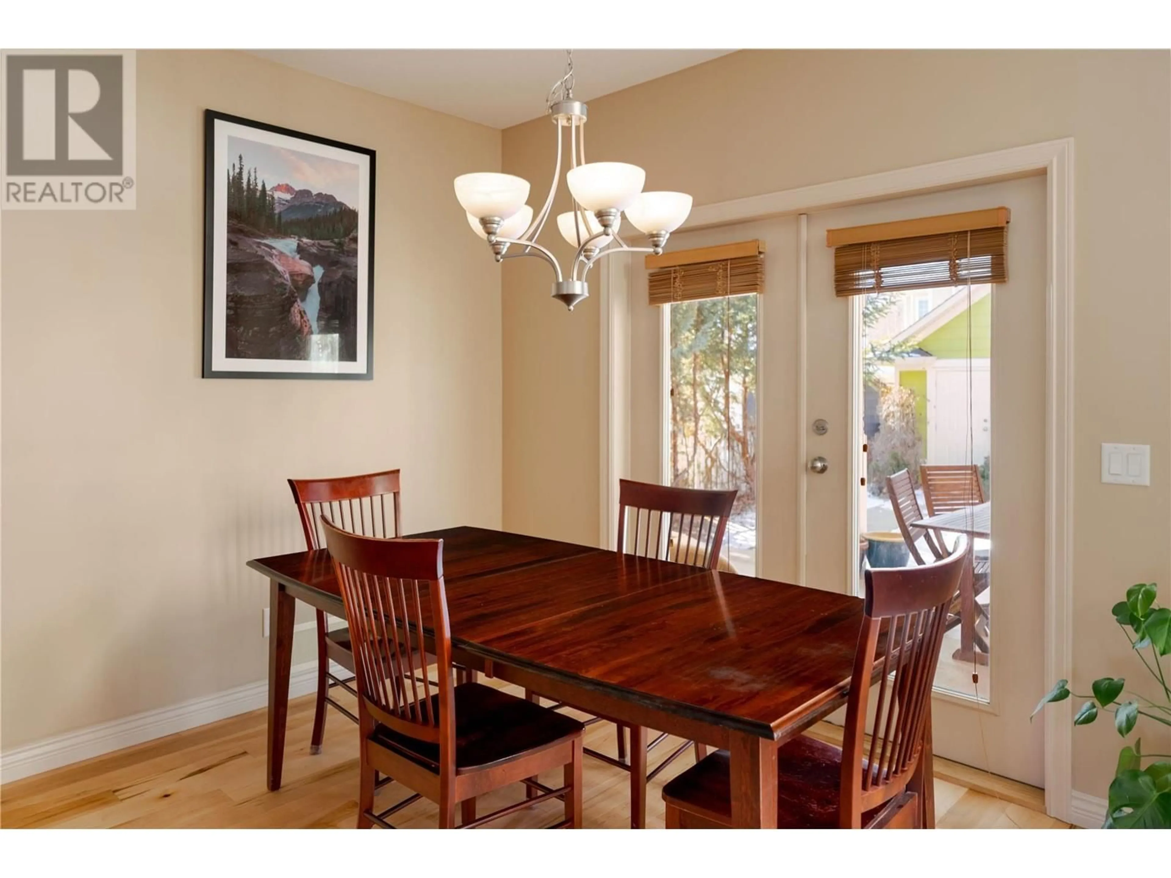 Dining room, wood/laminate floor for 5375 Ptarmigan Street, Kelowna British Columbia V1W5A4