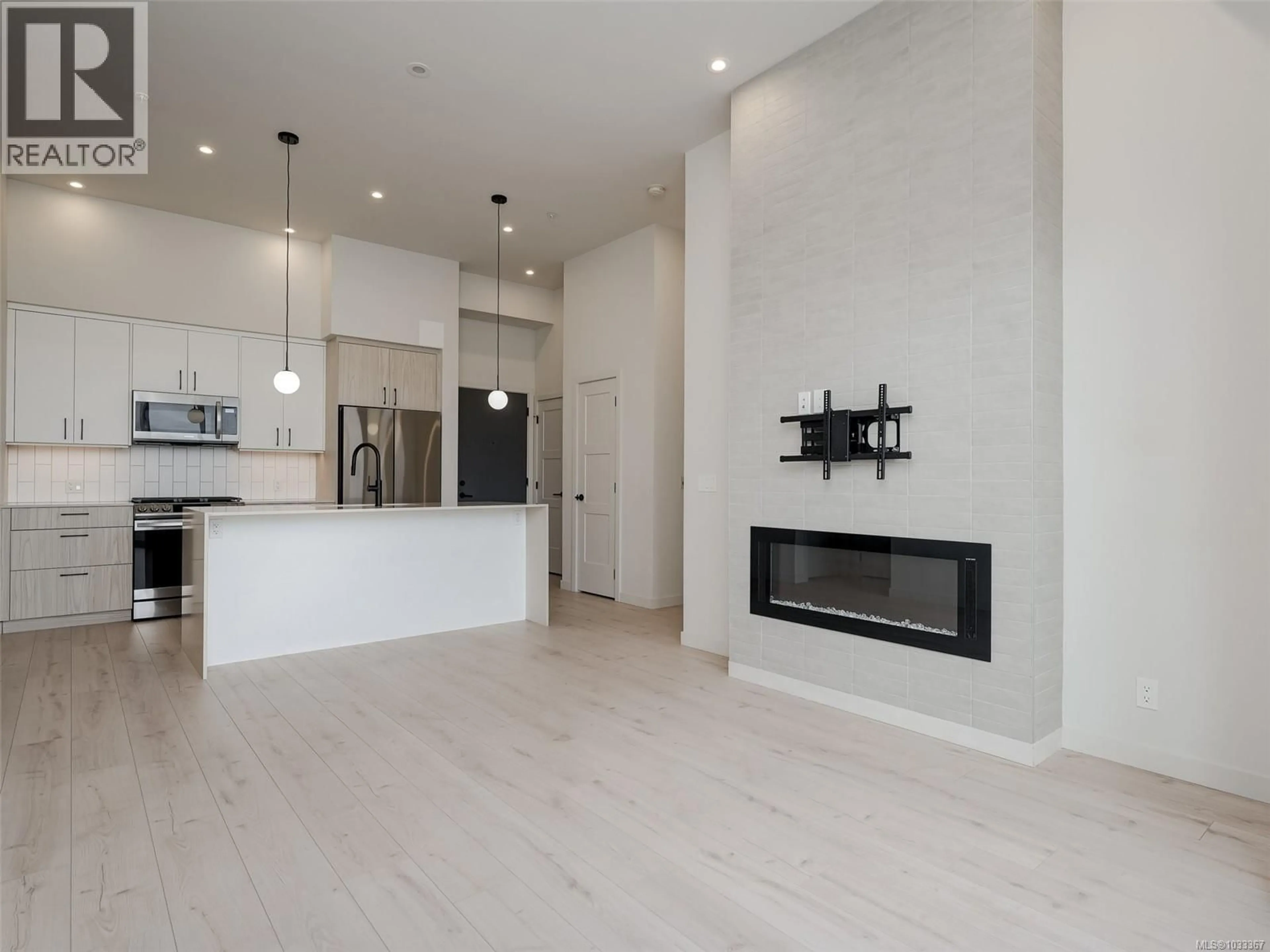 Open concept kitchen, wood/laminate floor for 607 - 958 PHAROAH MEWS, Langford British Columbia V9B7A1