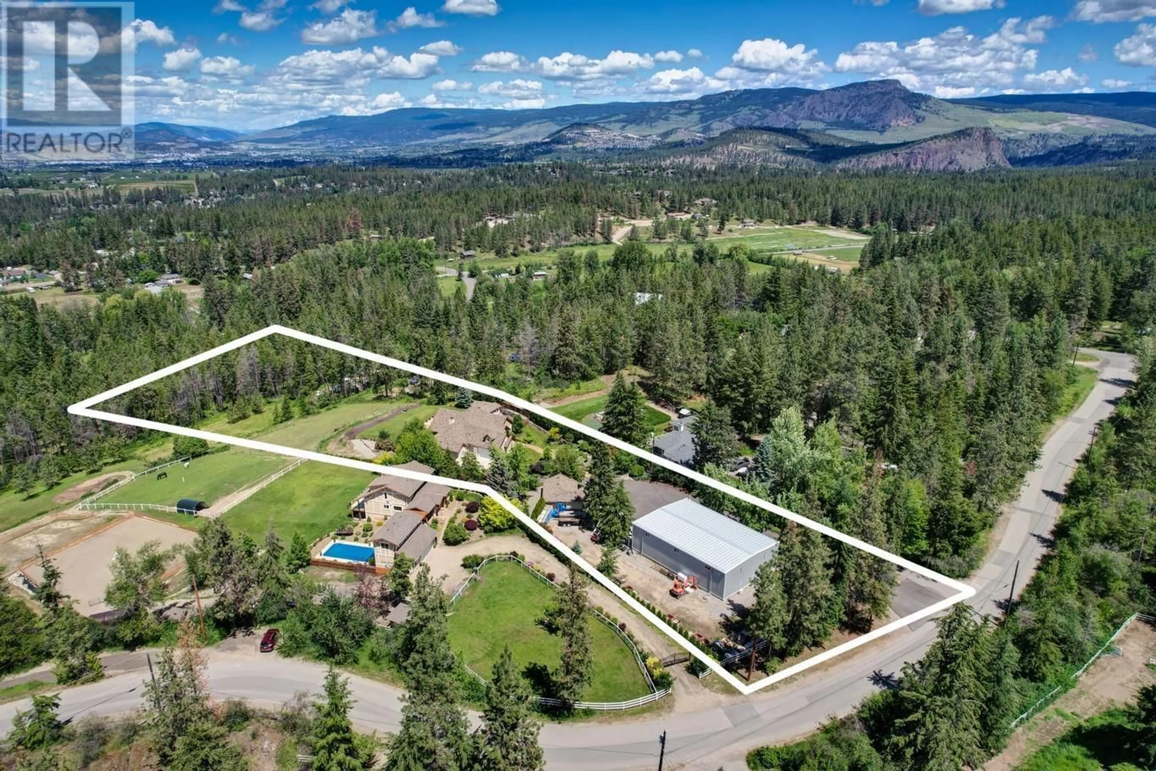A pic from outside/outdoor area/front of a property/back of a property/a pic from drone, mountain view for 3672 LUXMOORE ROAD, Kelowna British Columbia V1W4C7