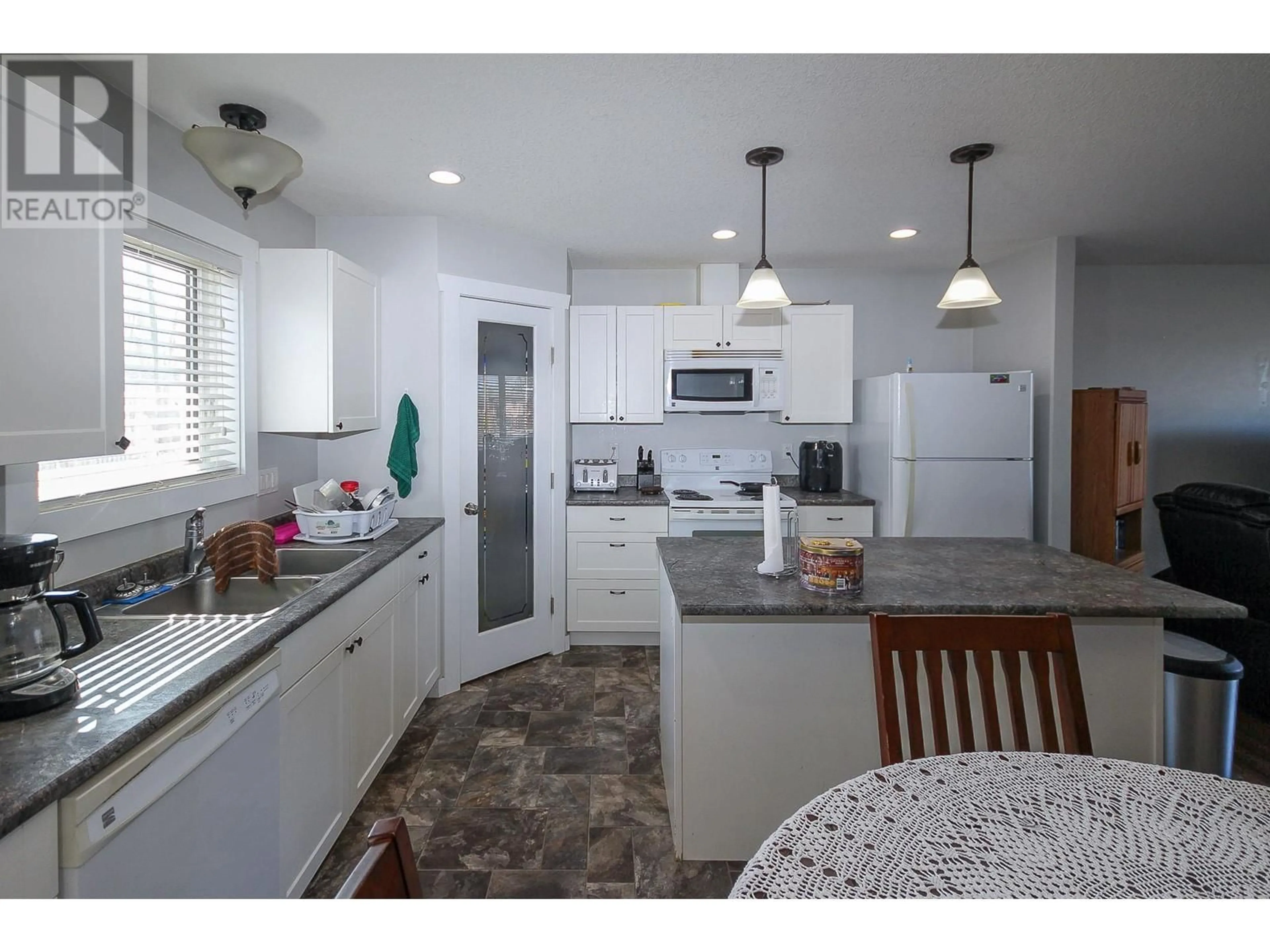 Open concept kitchen, ceramic/tile floor for 4803 56 AVENUE, Pouce Coupe British Columbia V0C2C0