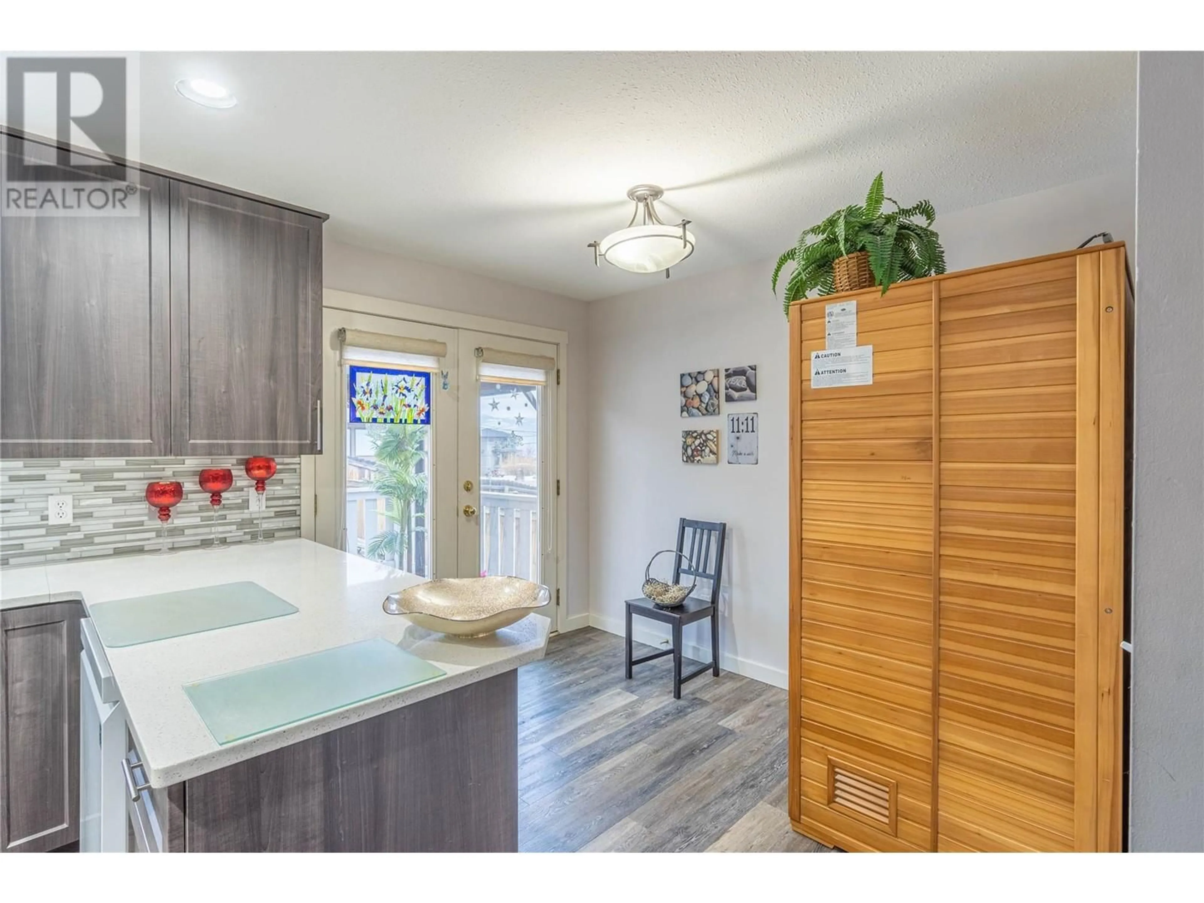 Open concept kitchen, wood/laminate floor for 114 Fernie Place, Kamloops British Columbia V2C6S4