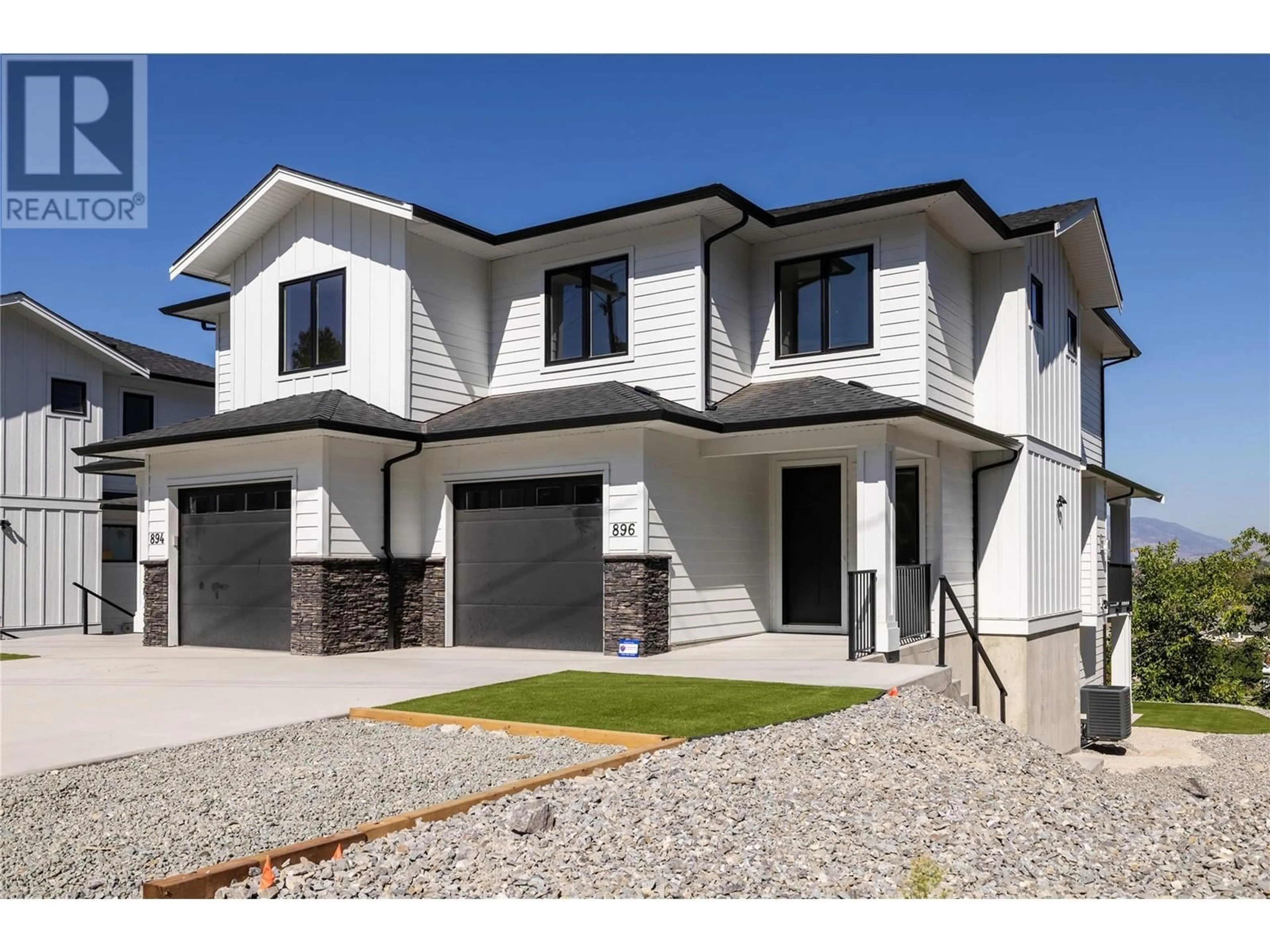 Home with vinyl exterior material, street for 896 Dehart Road, Kelowna British Columbia V1W4N2