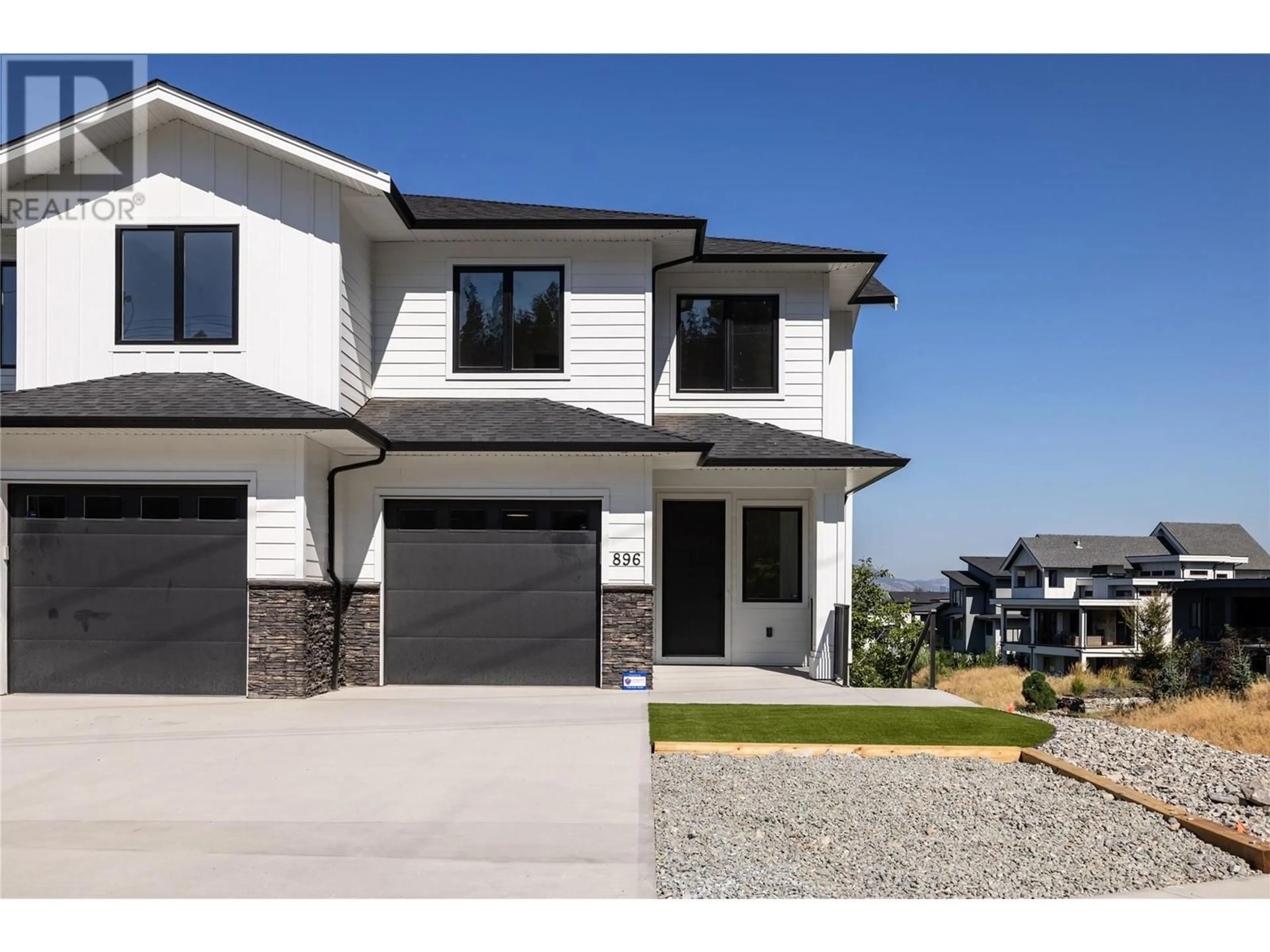 Home with vinyl exterior material, street for 896 Dehart Road, Kelowna British Columbia V1W4N2