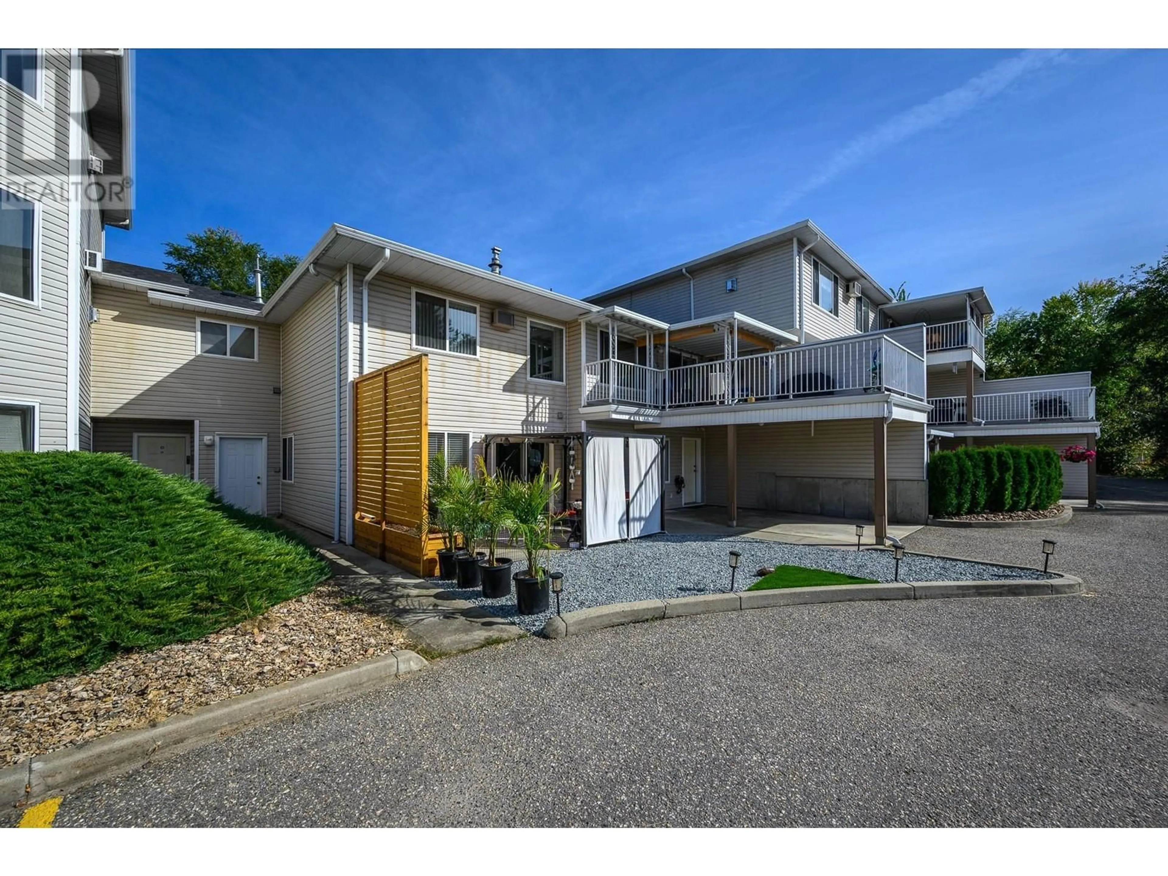 A pic from outside/outdoor area/front of a property/back of a property/a pic from drone, street for 4404 Pleasant Valley Road Unit# 3, Vernon British Columbia V1T4M3