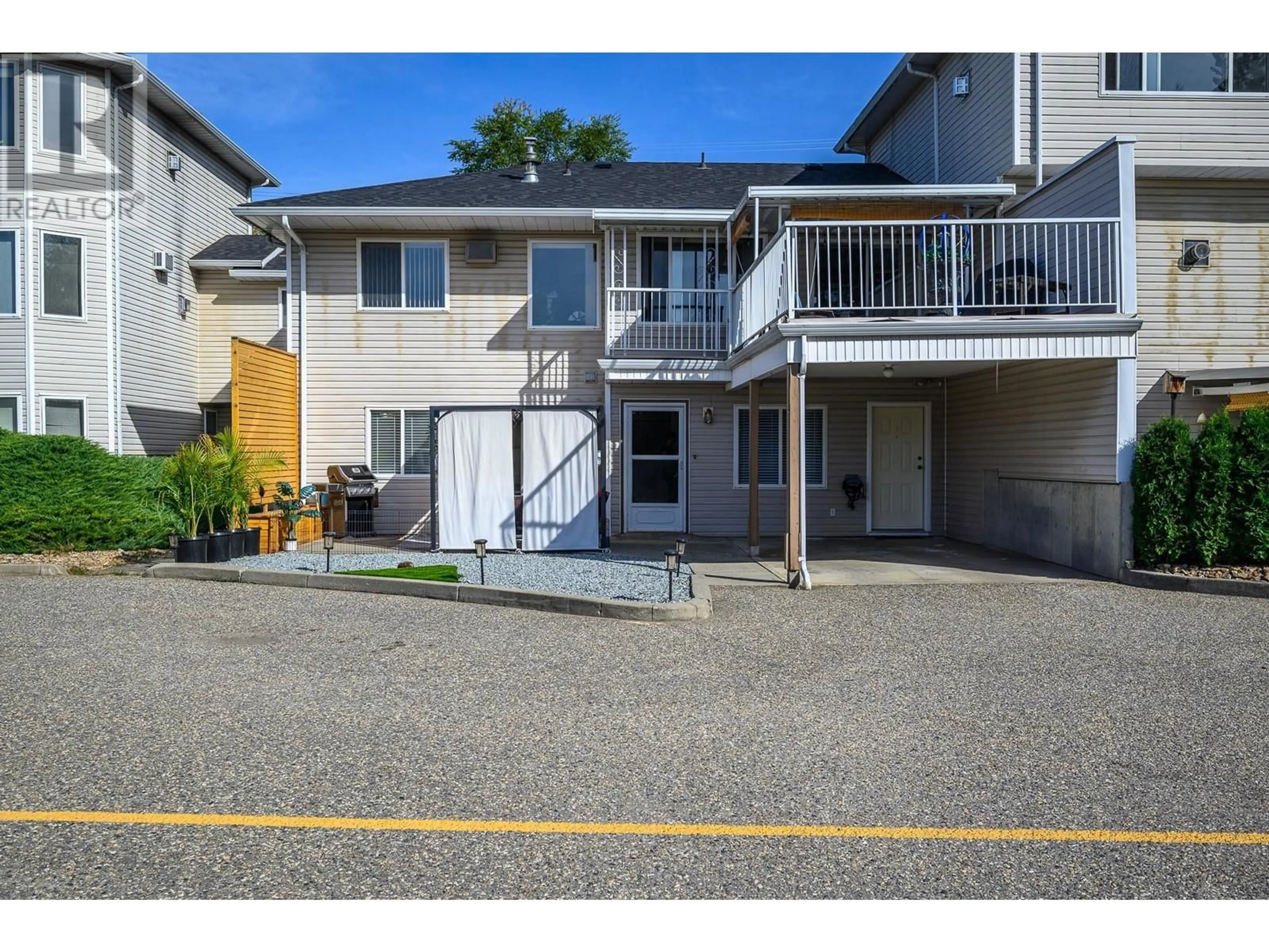 A pic from outside/outdoor area/front of a property/back of a property/a pic from drone, street for 4404 Pleasant Valley Road Unit# 3, Vernon British Columbia V1T4M3