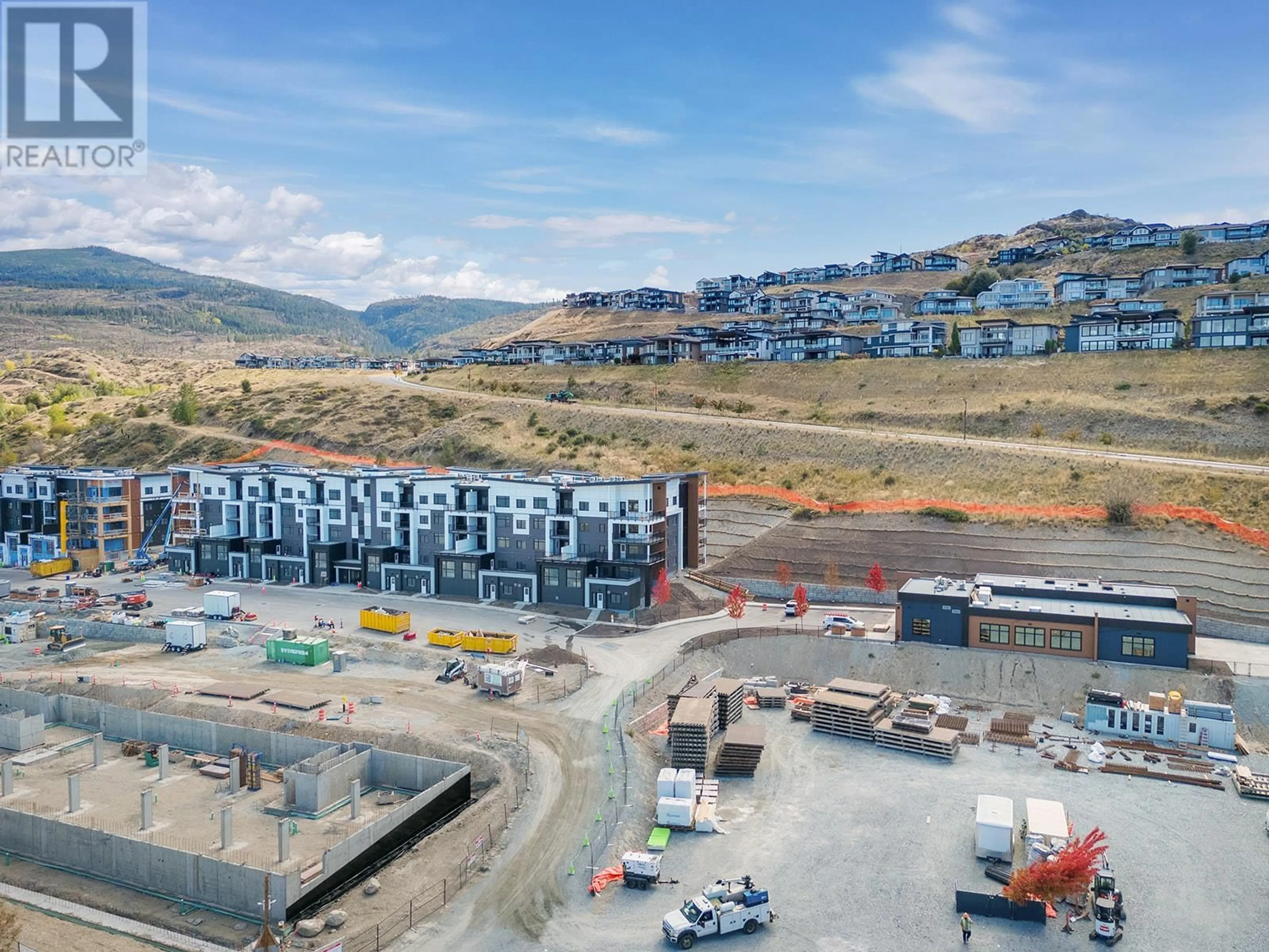 A pic from outside/outdoor area/front of a property/back of a property/a pic from drone, mountain view for 203 - 1057 FROST ROAD, Kelowna British Columbia V1W0G7