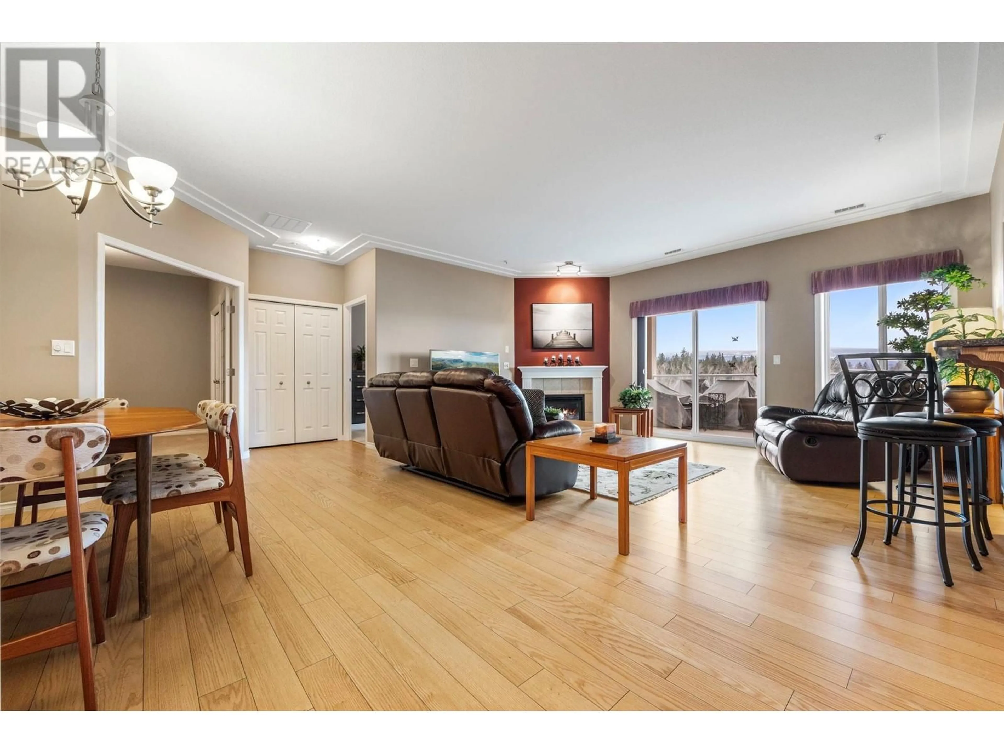 Living room with furniture, wood/laminate floor for 802 - 1967 UNDERHILL STREET, Kelowna British Columbia V1X8C9