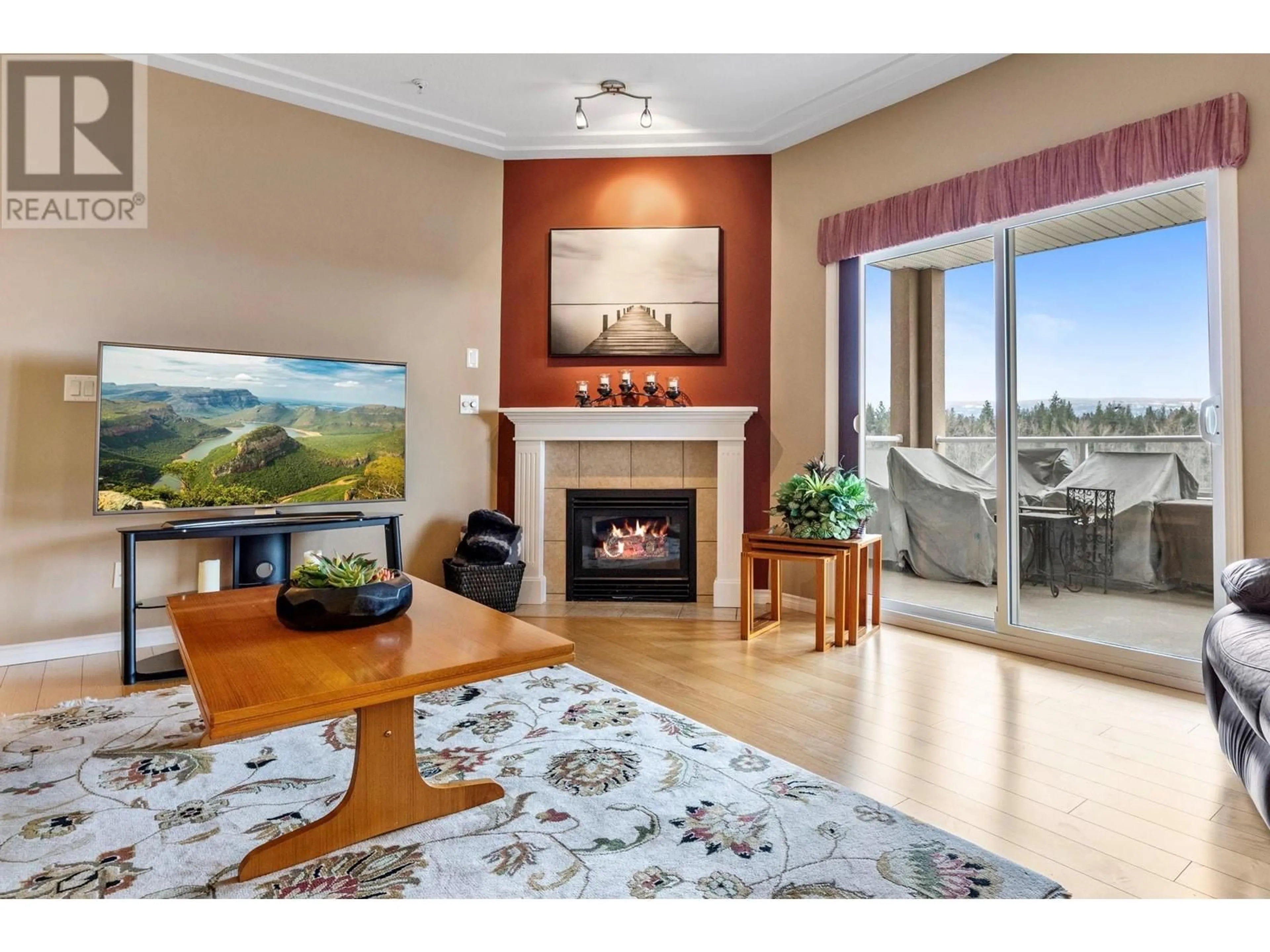 Living room with furniture, wood/laminate floor for 802 - 1967 UNDERHILL STREET, Kelowna British Columbia V1X8C9