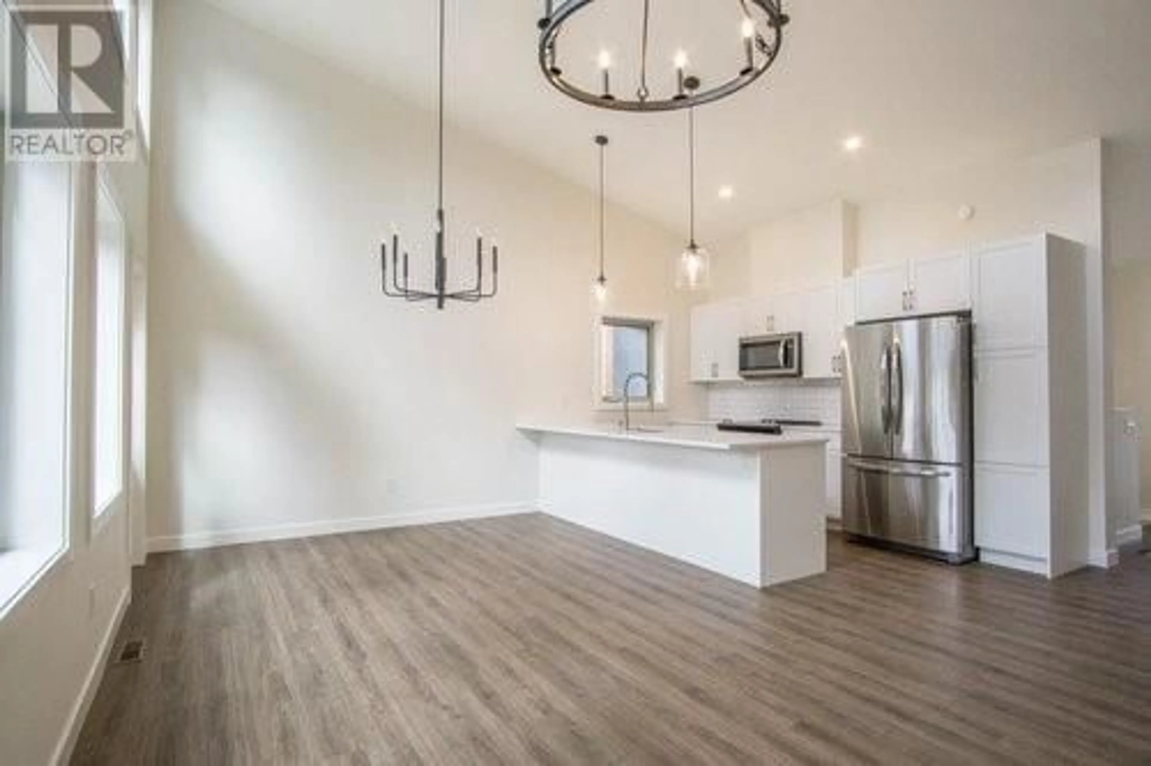 Open concept kitchen, wood/laminate floor for 4926 Timber Ridge Road Unit# 42, Windermere British Columbia V0B1L0