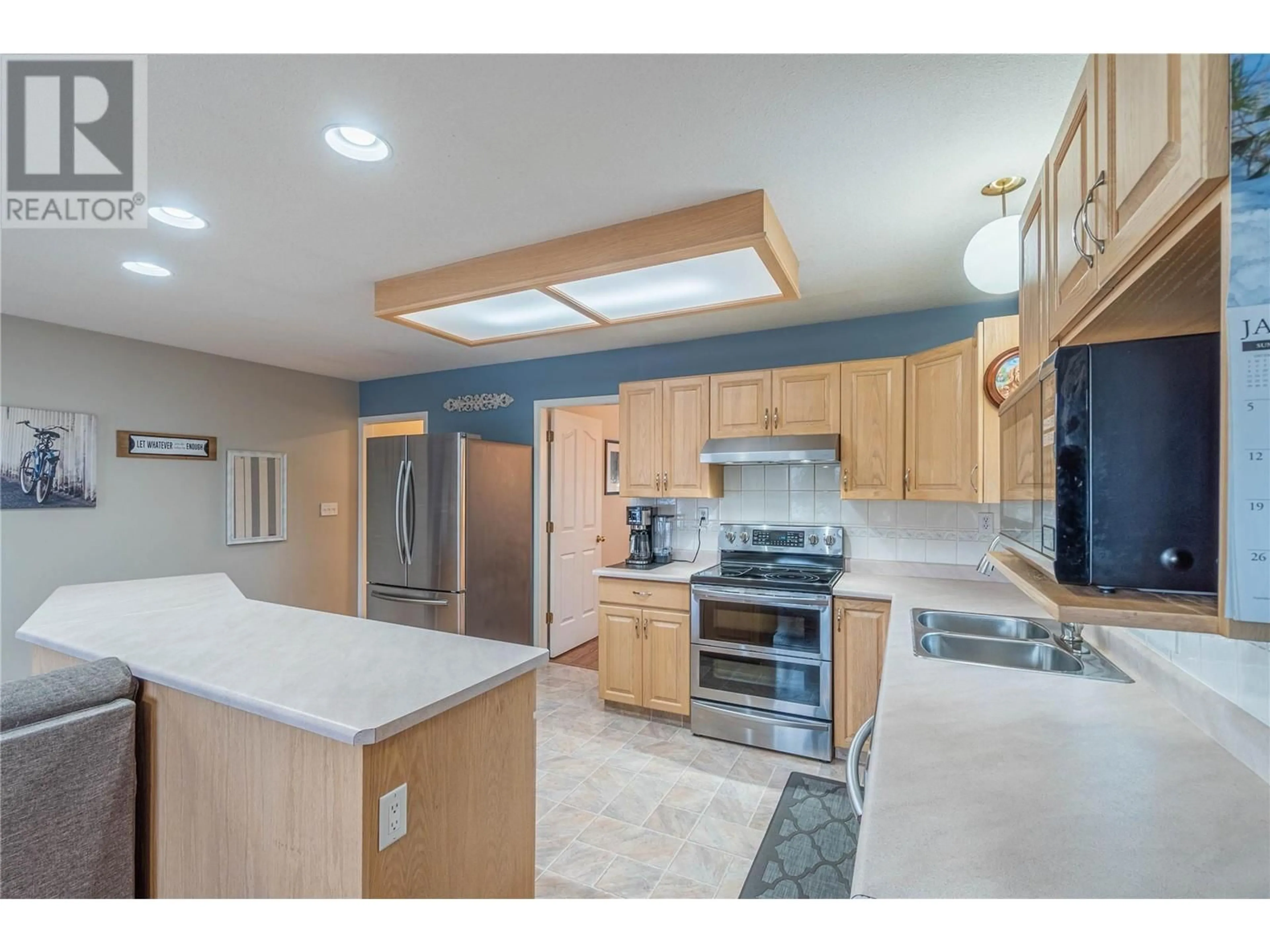 Open concept kitchen, ceramic/tile floor for 301 TUXFORD Drive, Kamloops British Columbia V2E2L4