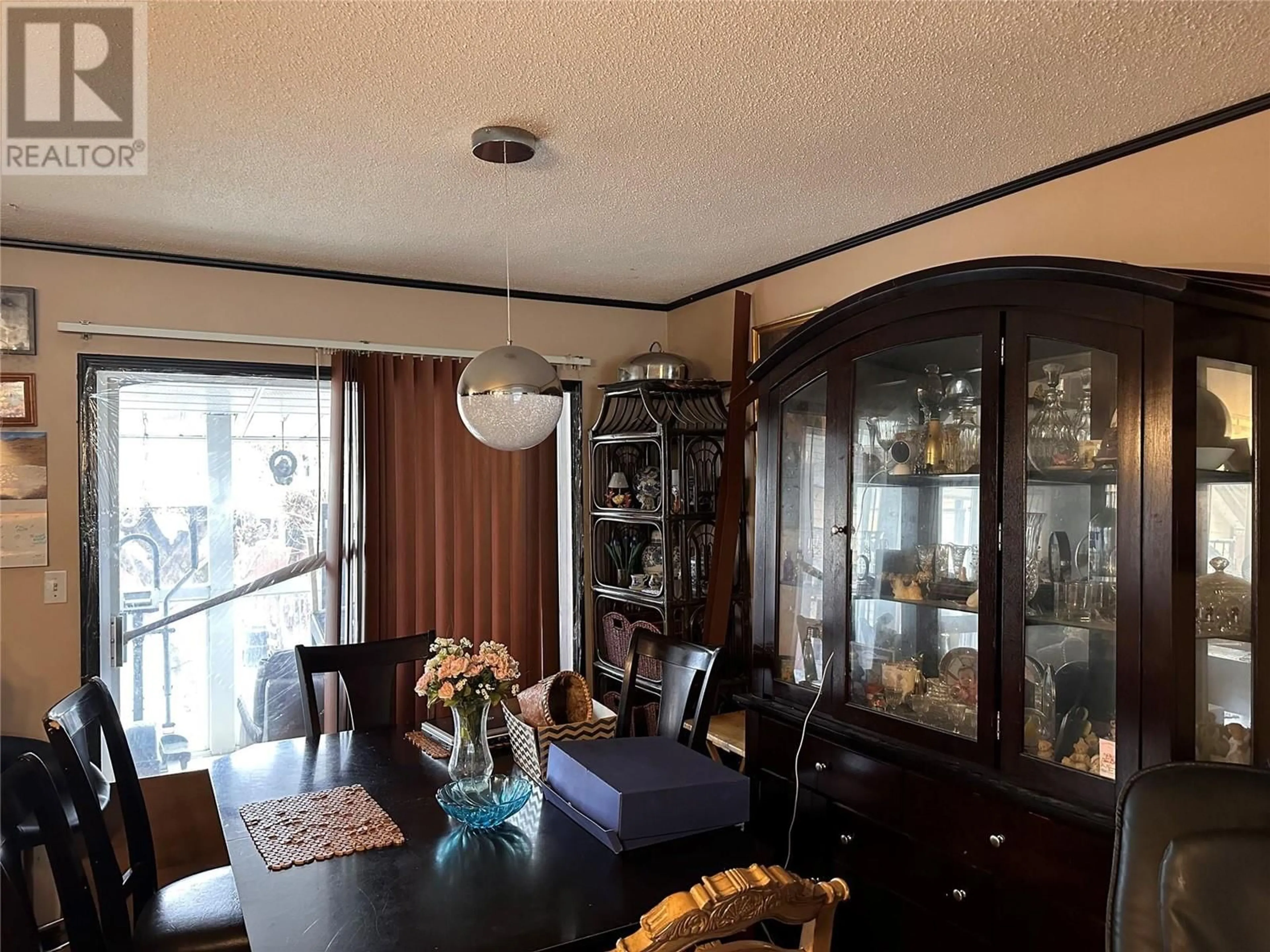 Dining room, wood/laminate floor for 920 Pitcairn Court, Kelowna British Columbia V1Y4E5