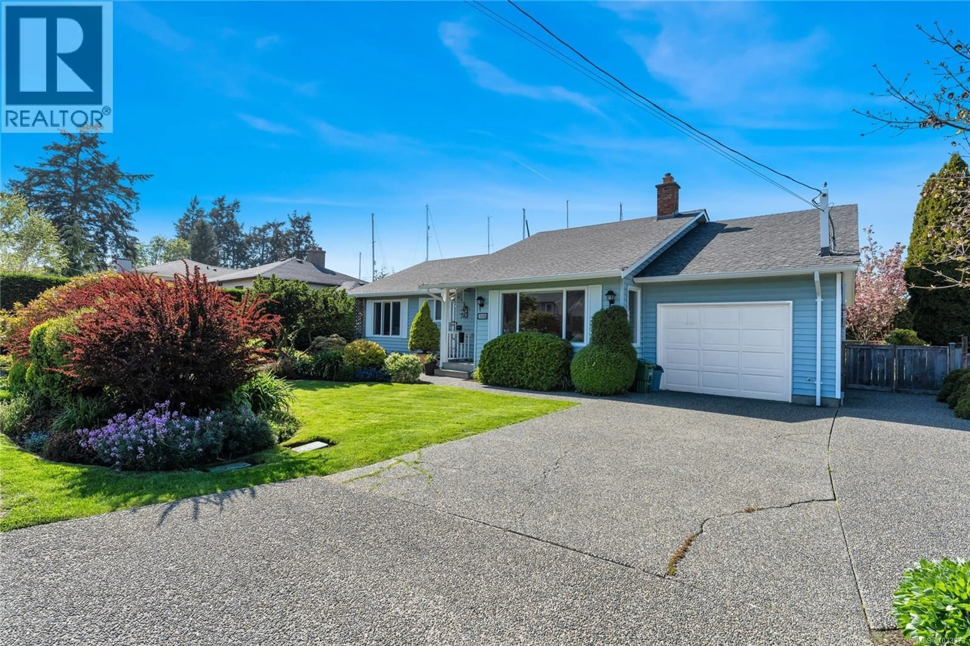 A pic from outside/outdoor area/front of a property/back of a property/a pic from drone, street for 10448 ALLBAY ROAD, Sidney British Columbia V8L2P1