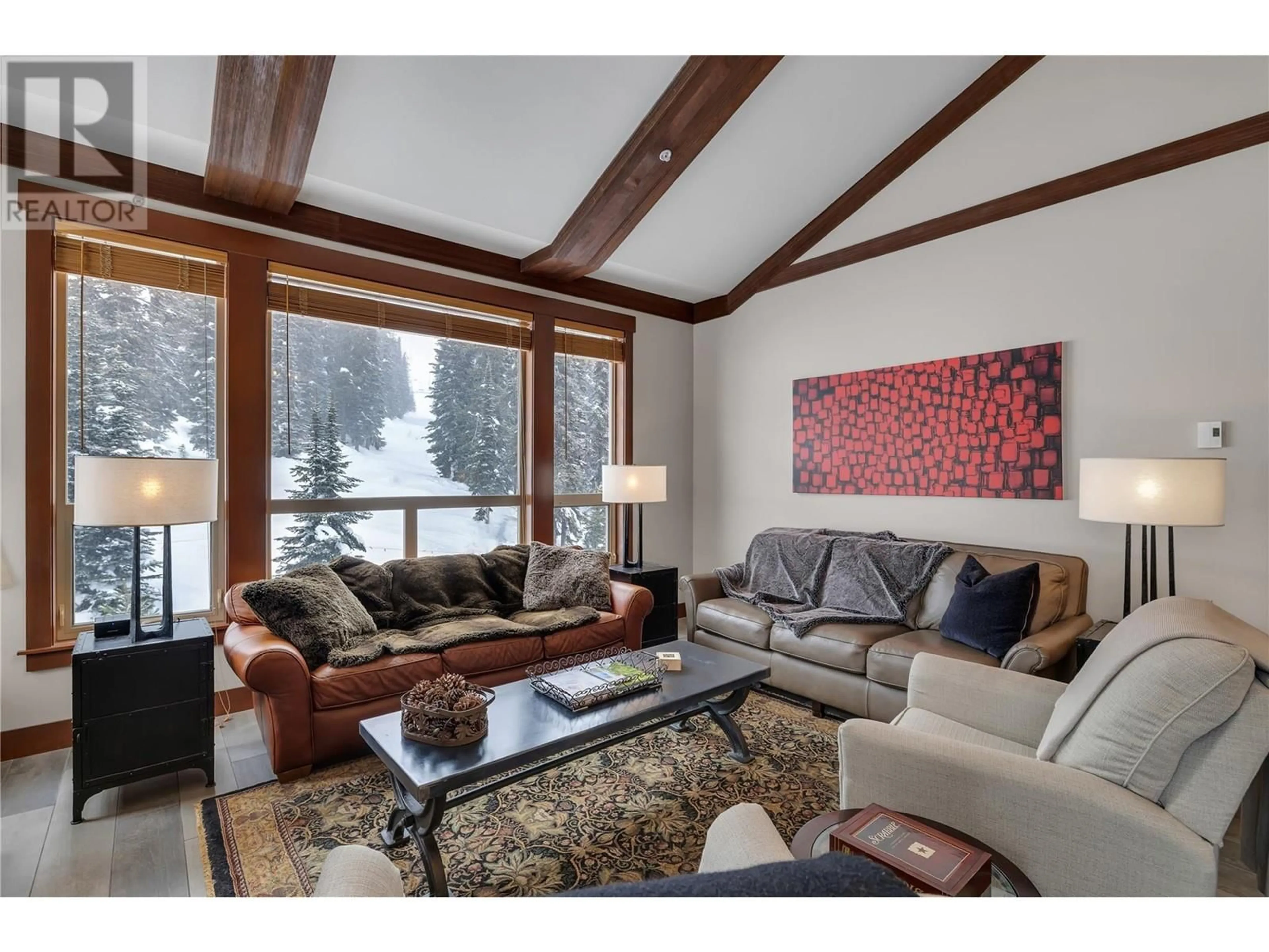 Living room with furniture, wood/laminate floor for 403/404 - 5257 BIG WHITE ROAD, Big White British Columbia V1P1P3