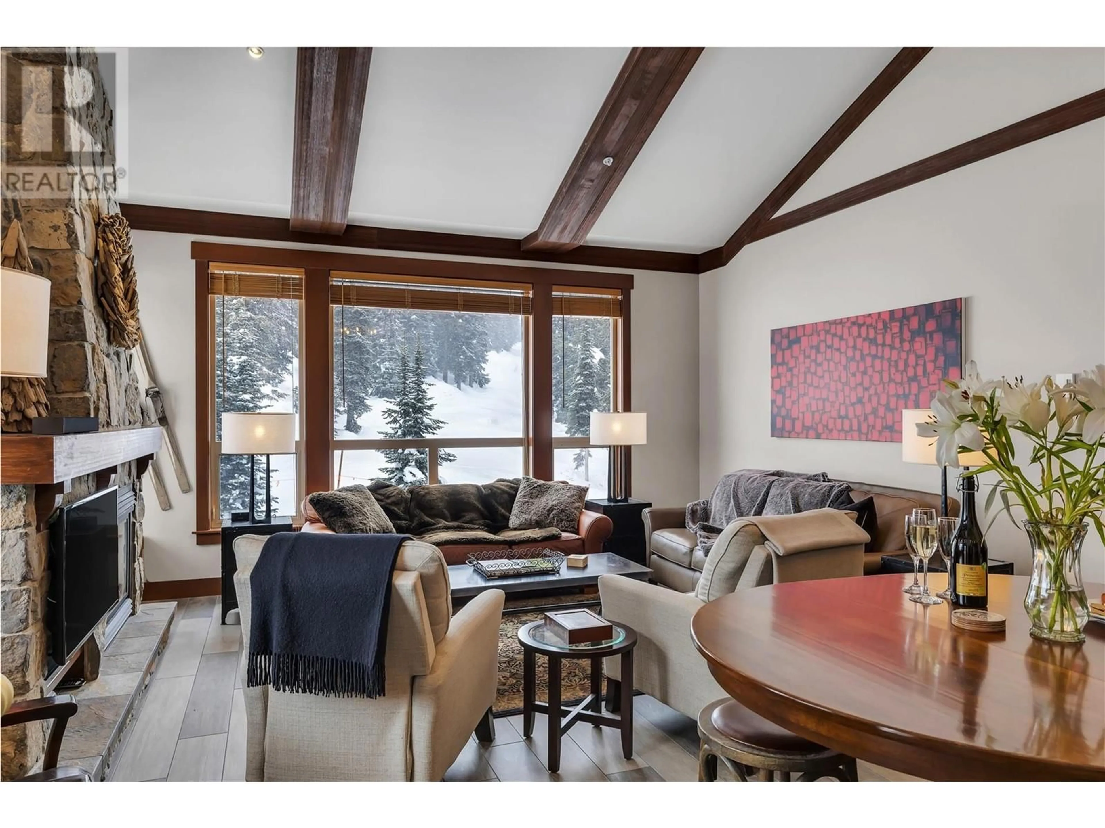 Living room with furniture, wood/laminate floor for 403/404 - 5257 BIG WHITE ROAD, Big White British Columbia V1P1P3