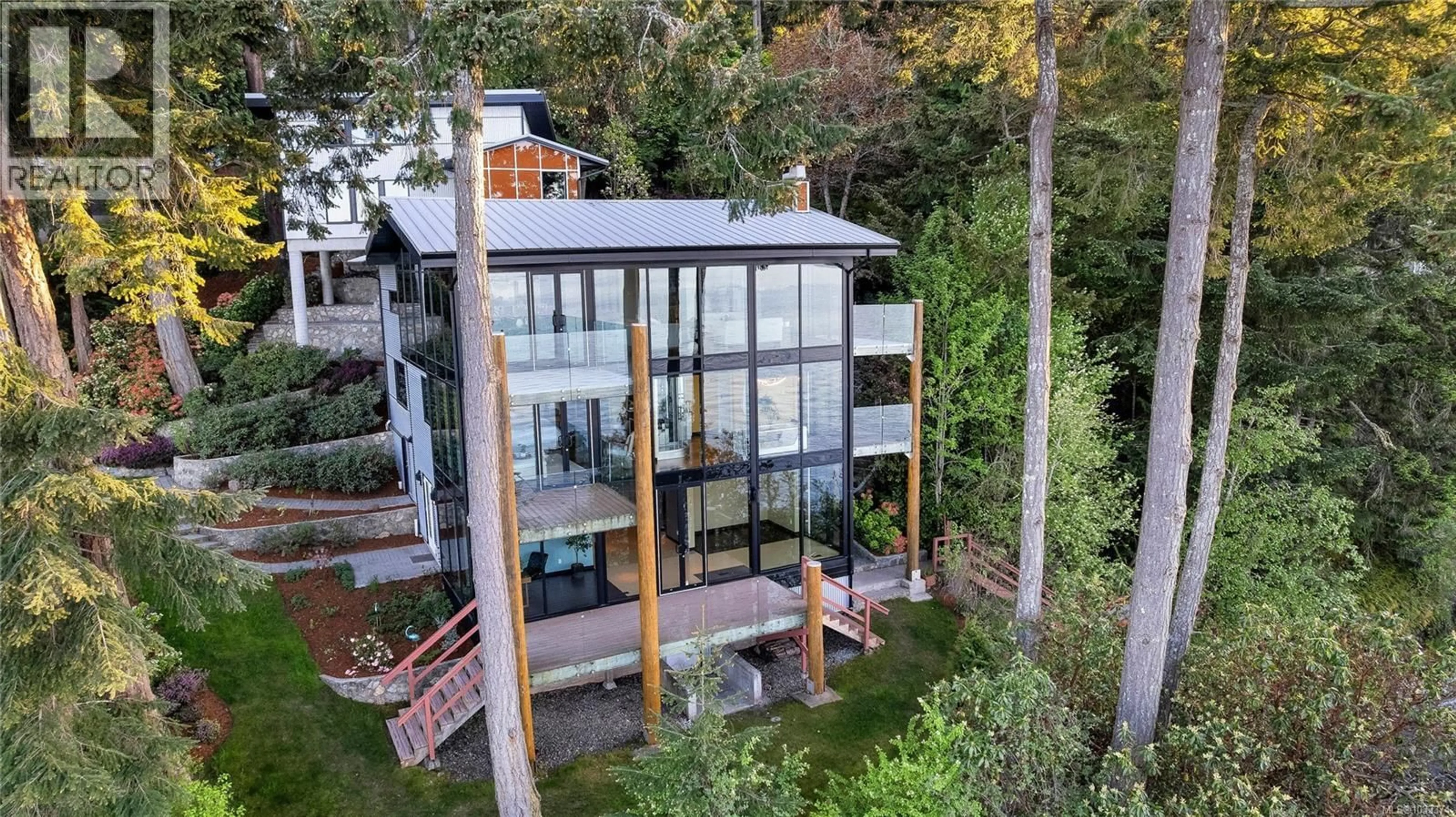 A pic from outside/outdoor area/front of a property/back of a property/a pic from drone, building for 1676 LANDS END ROAD, North Saanich British Columbia V8L5L5
