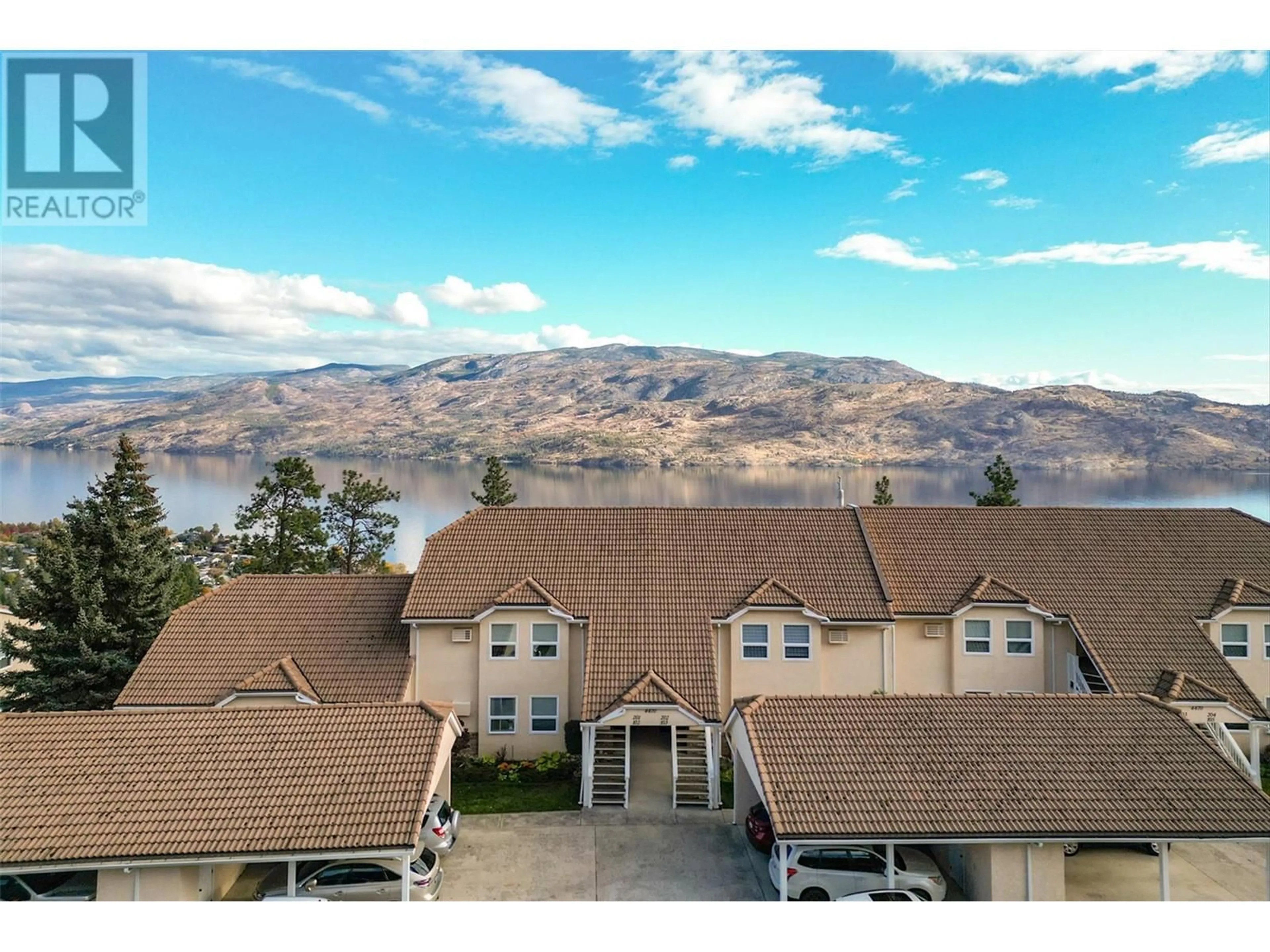 A pic from outside/outdoor area/front of a property/back of a property/a pic from drone, water/lake/river/ocean view for 4470 Ponderosa Drive Unit# 103, Peachland British Columbia V0H1X5