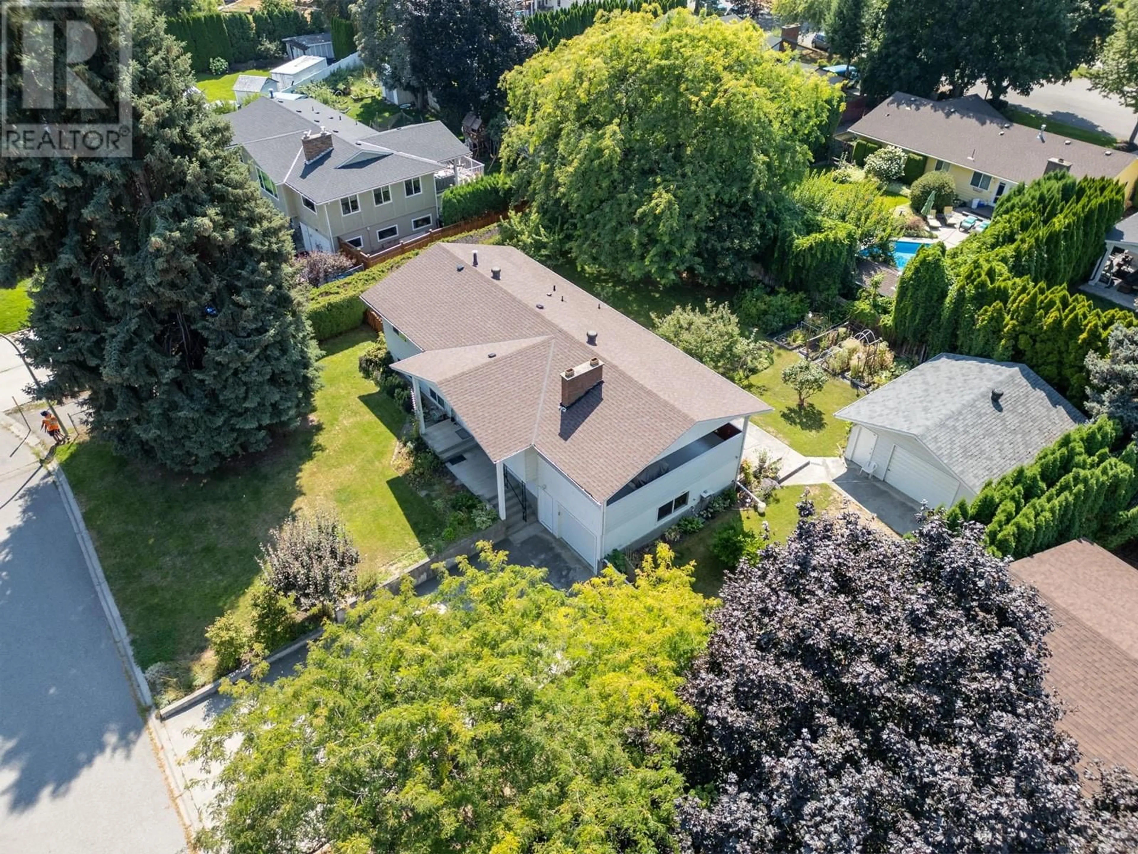 A pic from outside/outdoor area/front of a property/back of a property/a pic from drone, street for 669 Paret Place, Kelowna British Columbia V1W2K6