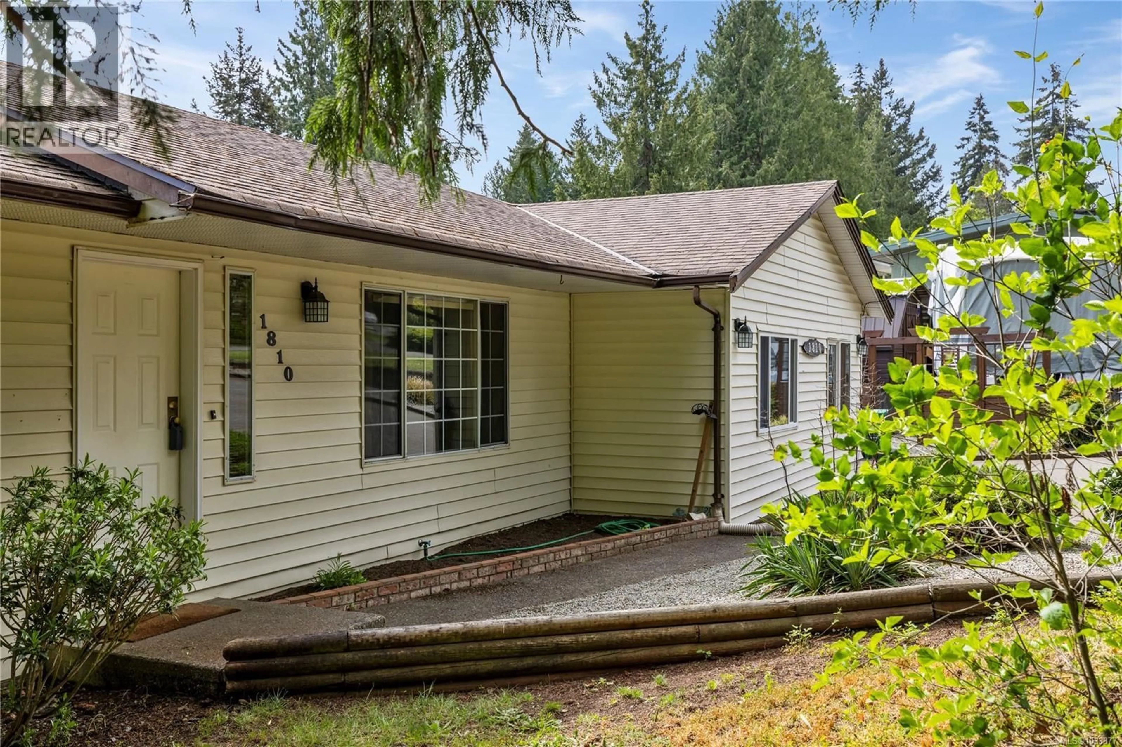 Home with vinyl exterior material, street for 1810 EXTENSION ROAD, Nanaimo British Columbia V9X1C9