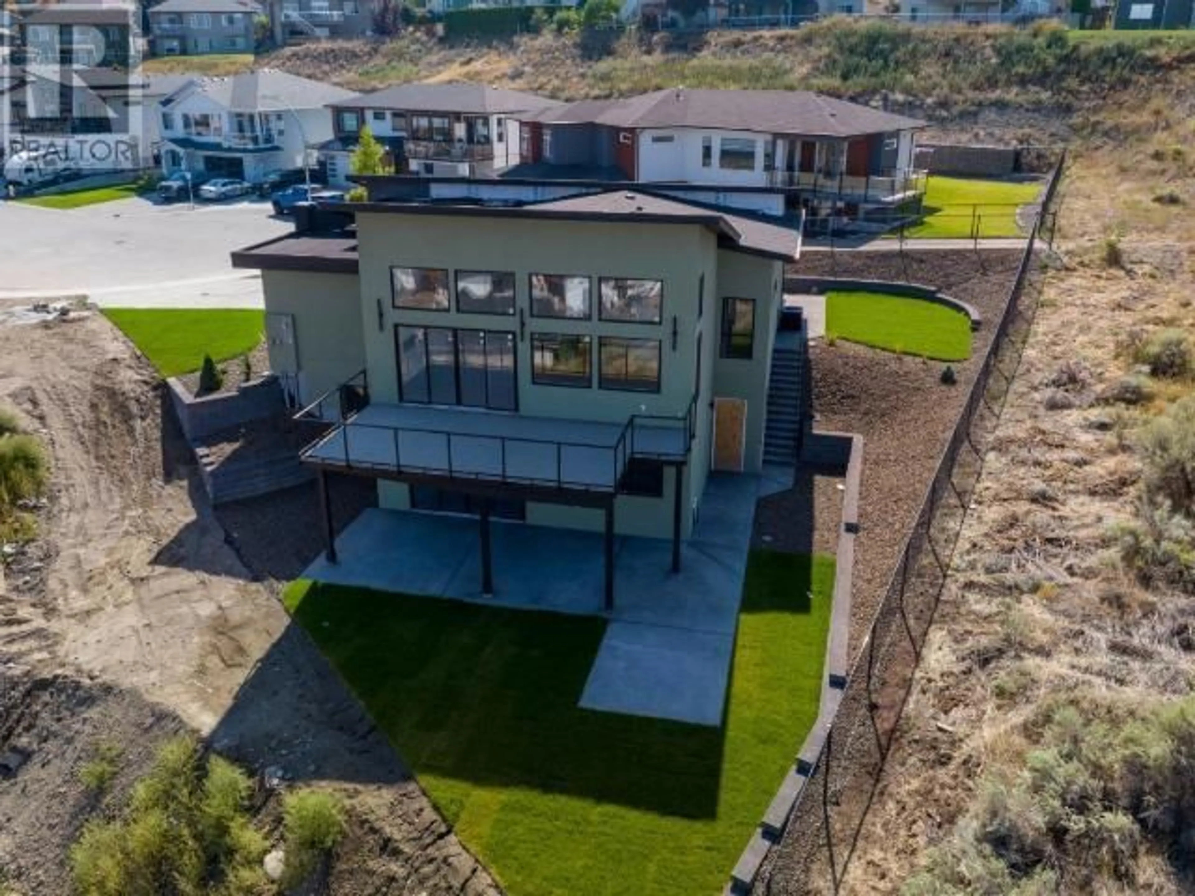 A pic from outside/outdoor area/front of a property/back of a property/a pic from drone, water/lake/river/ocean view for 2400 Talbot Place, Kamloops British Columbia V1S2B2