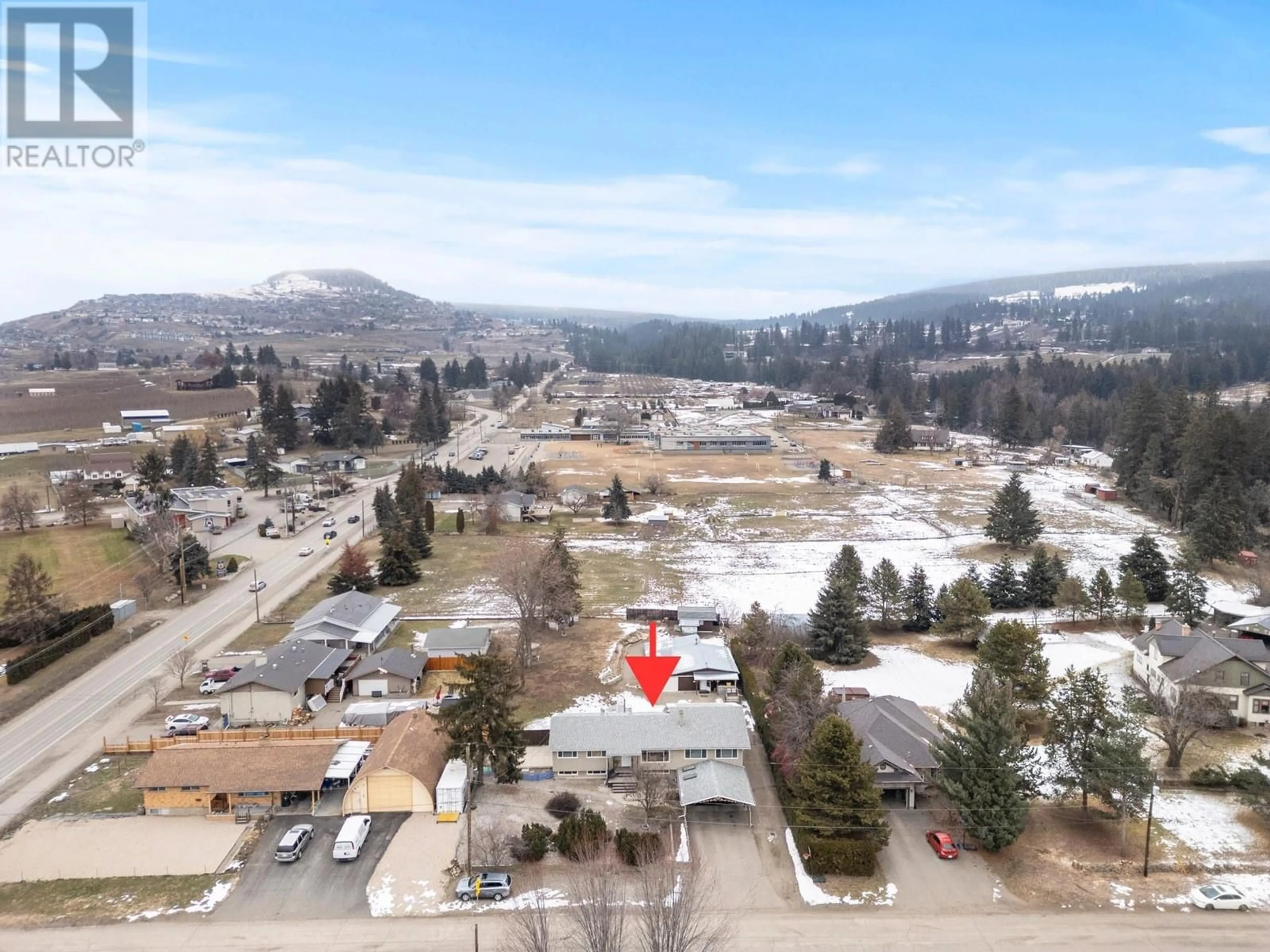 A pic from outside/outdoor area/front of a property/back of a property/a pic from drone, mountain view for 5739 Barker Road, Vernon British Columbia V1B3P5