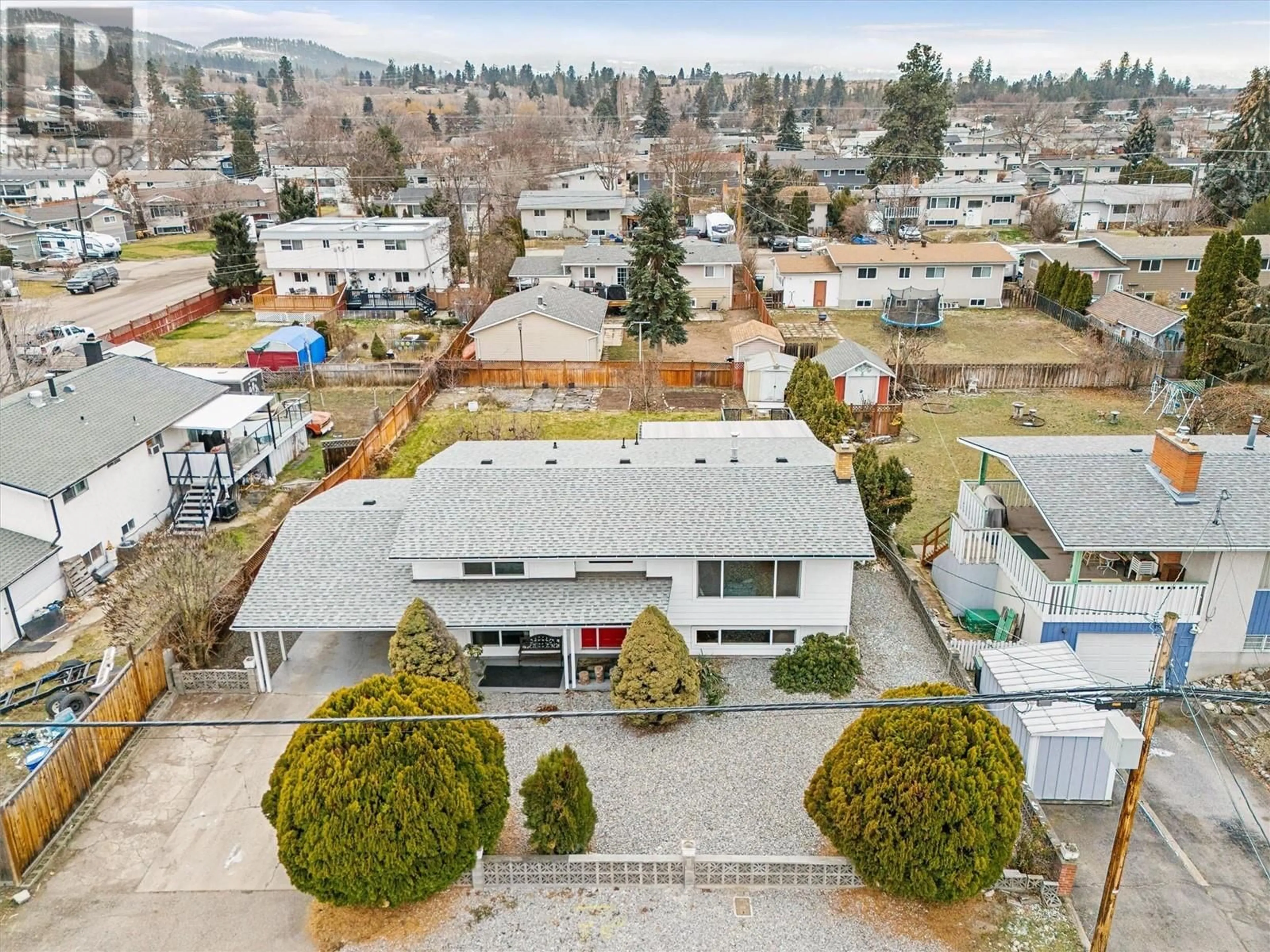 A pic from outside/outdoor area/front of a property/back of a property/a pic from drone, mountain view for 345 Holbrook Road E, Kelowna British Columbia V1X1S7