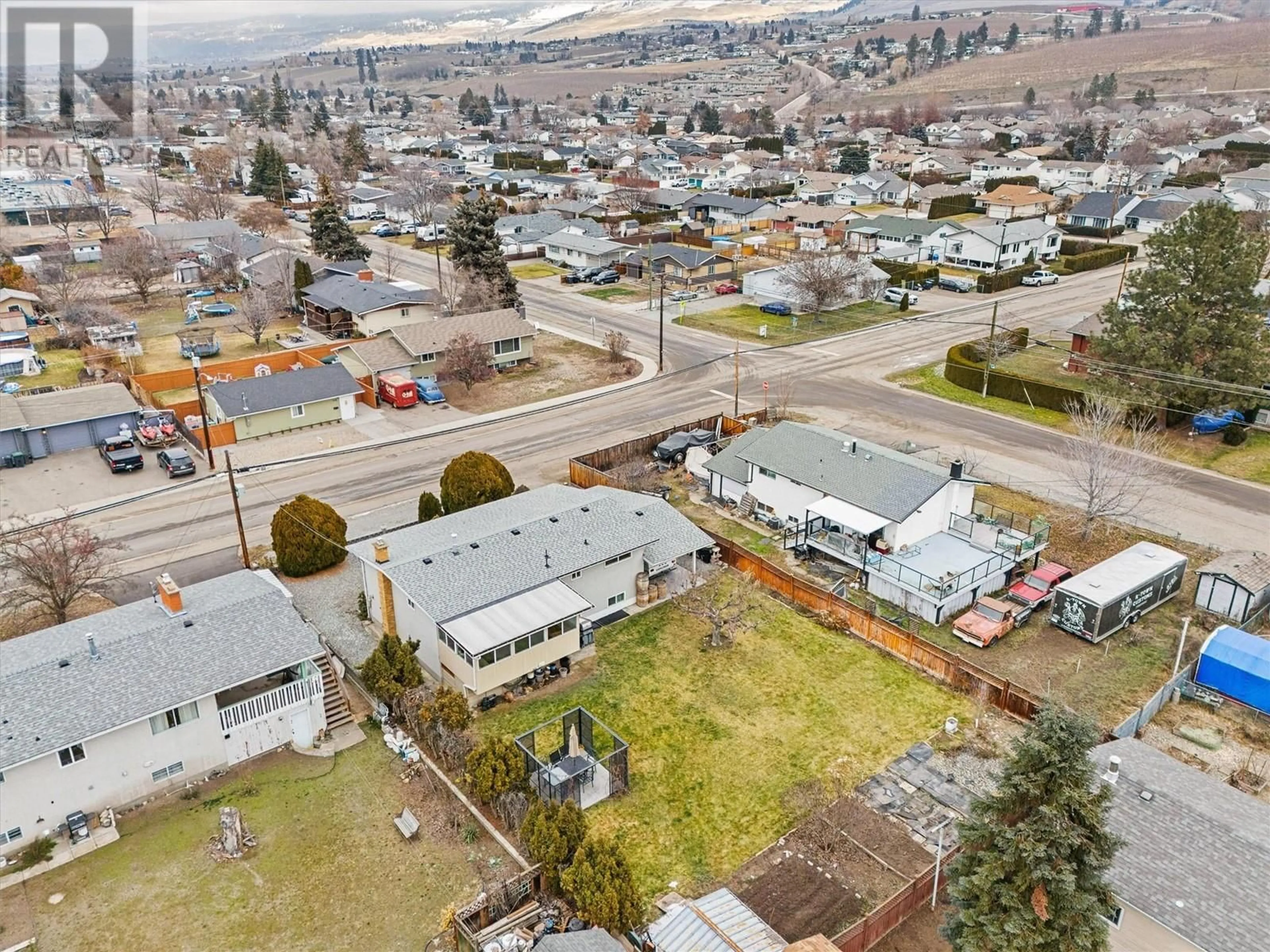 A pic from outside/outdoor area/front of a property/back of a property/a pic from drone, street for 345 Holbrook Road E, Kelowna British Columbia V1X1S7