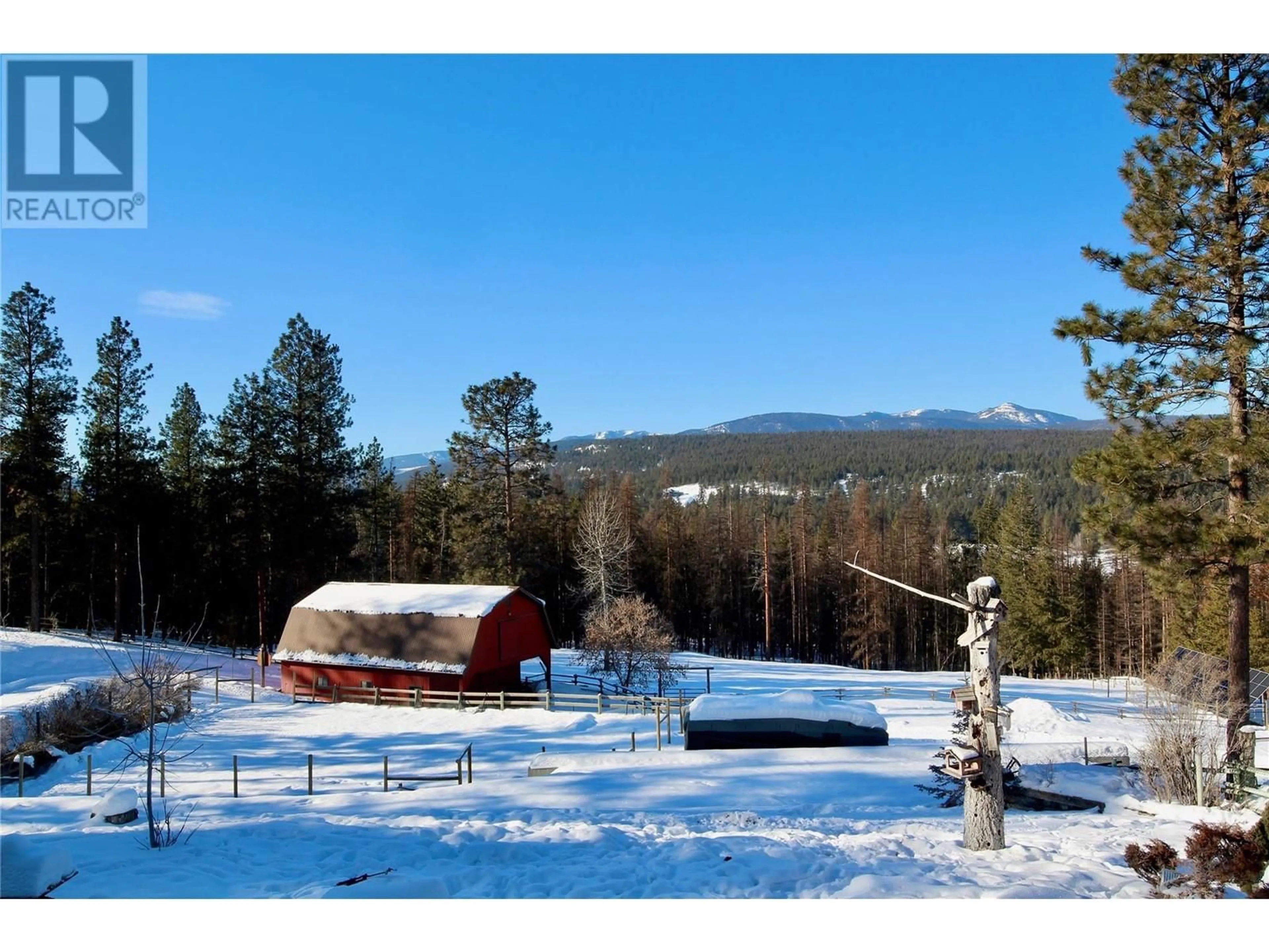 A pic from outside/outdoor area/front of a property/back of a property/a pic from drone, mountain view for 3749 SILVER SPRING Drive, Cranbrook British Columbia V1C6X8