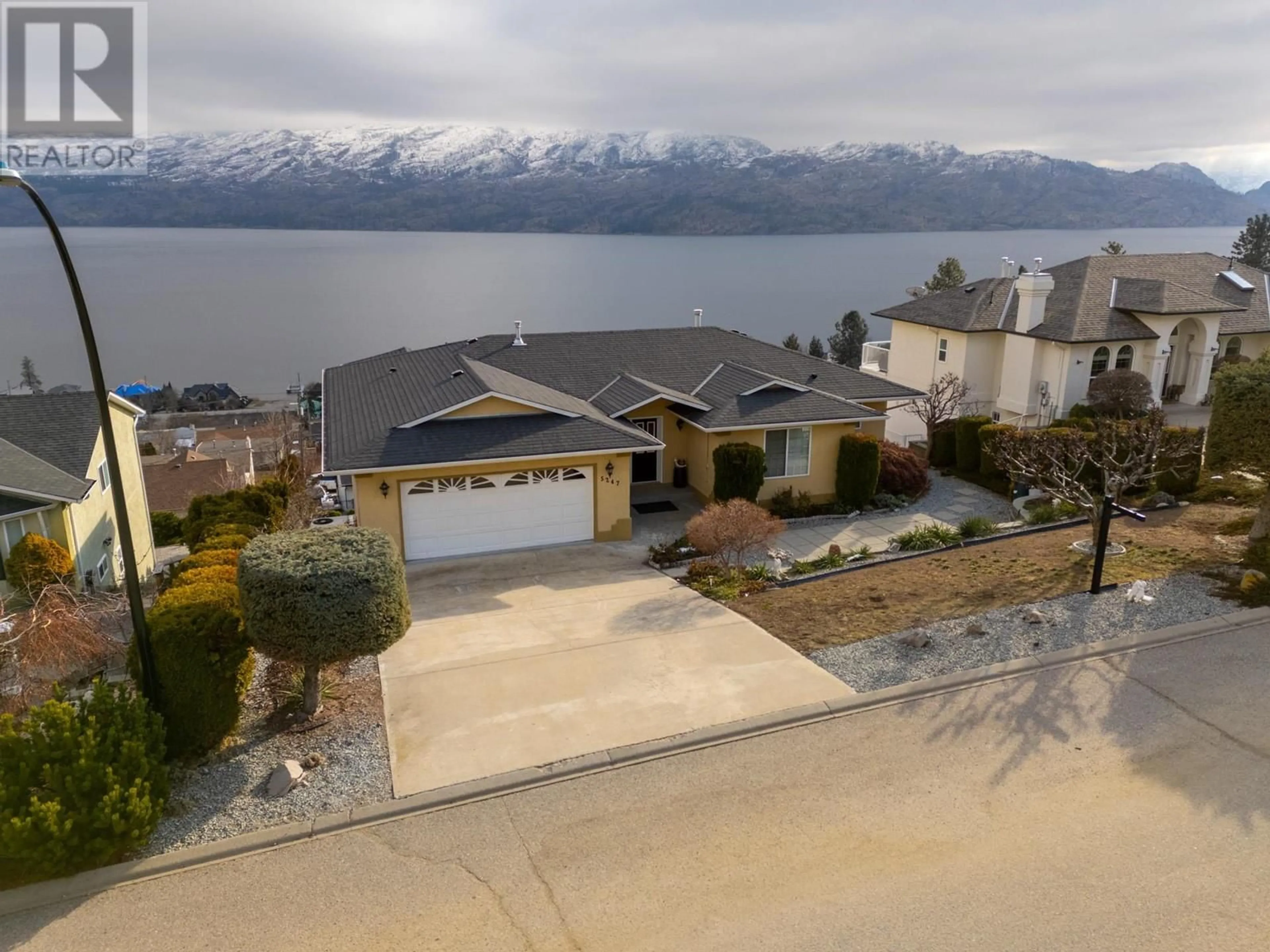 A pic from outside/outdoor area/front of a property/back of a property/a pic from drone, water/lake/river/ocean view for 5247 Sutherland Road, Peachland British Columbia V0H1X2