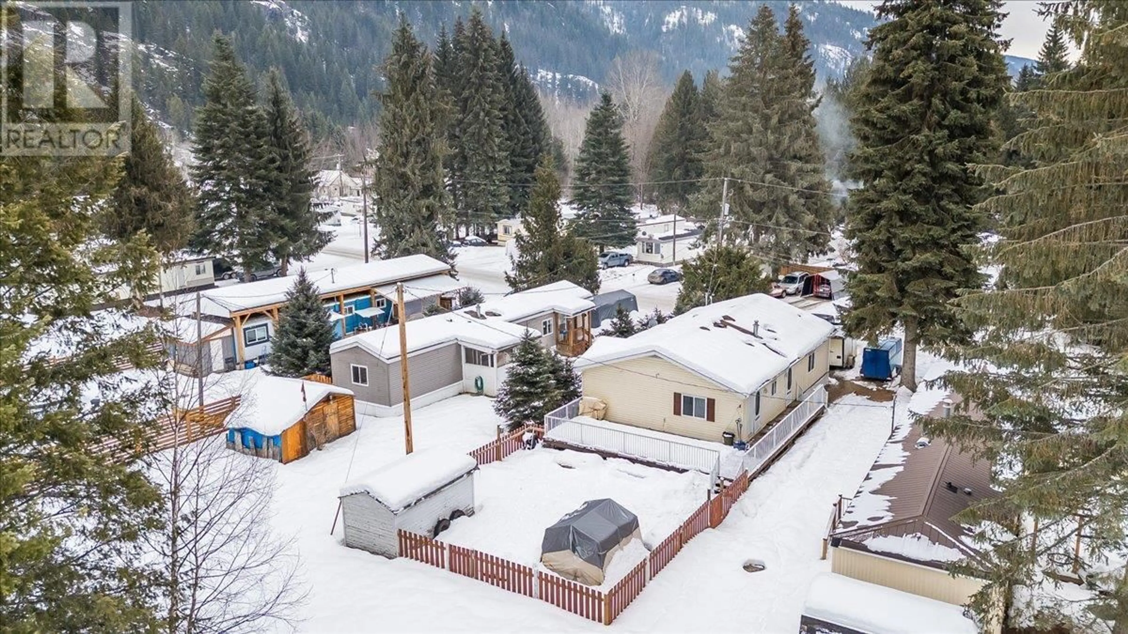 A pic from outside/outdoor area/front of a property/back of a property/a pic from drone, mountain view for 10 - 916 AIRPORT ROAD HIGHWAY, Salmo British Columbia V0G1Z0