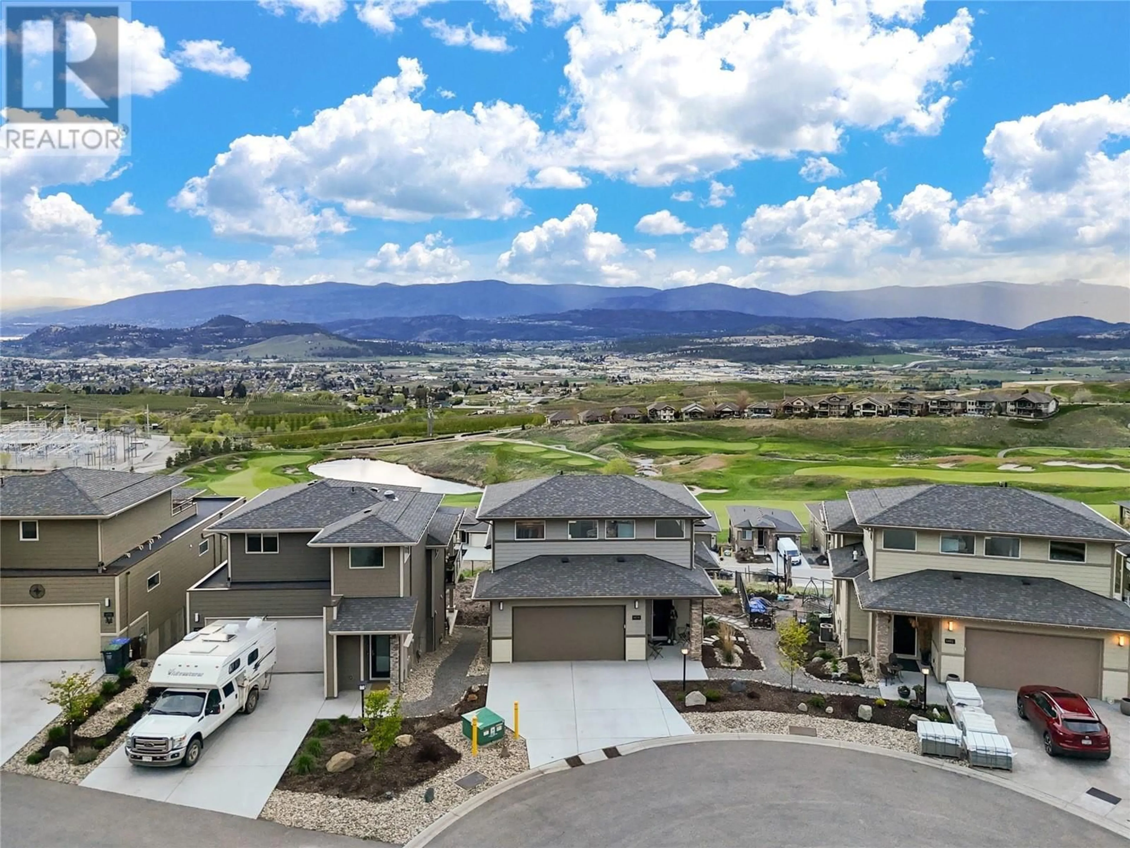 A pic from outside/outdoor area/front of a property/back of a property/a pic from drone, mountain view for 1474 Summer Crescent, Kelowna British Columbia V1P1T8