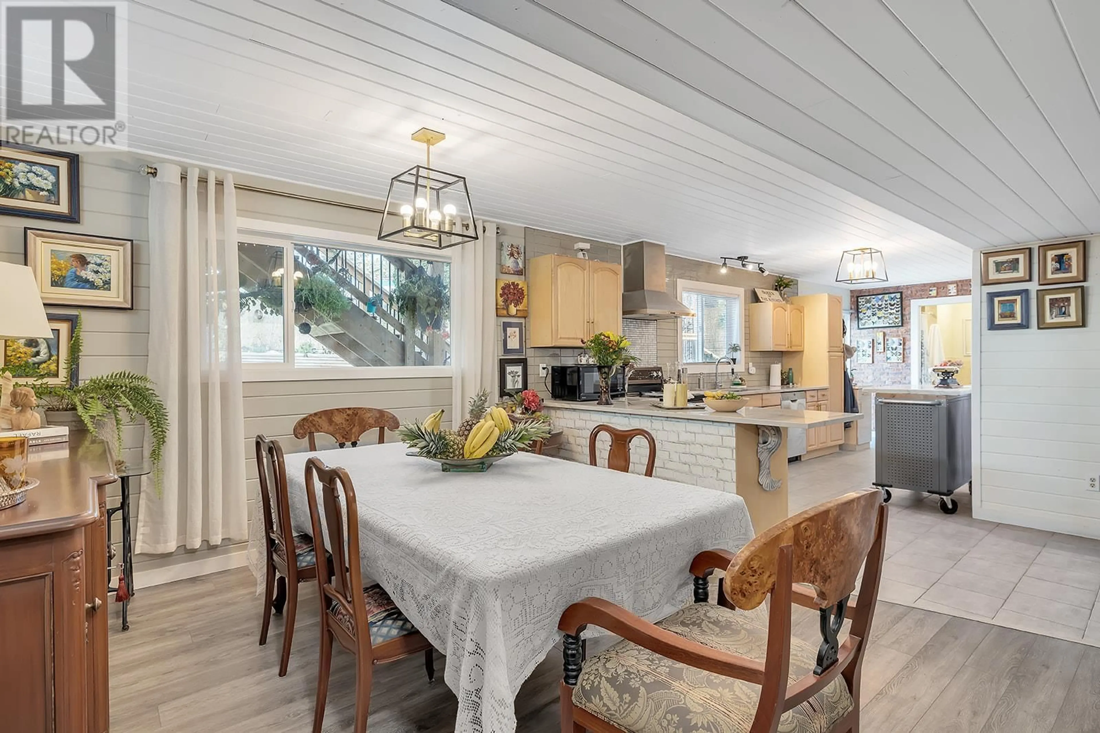 Dining room, wood/laminate floor for 3105 Shannon Place, West Kelowna British Columbia V4T1T4