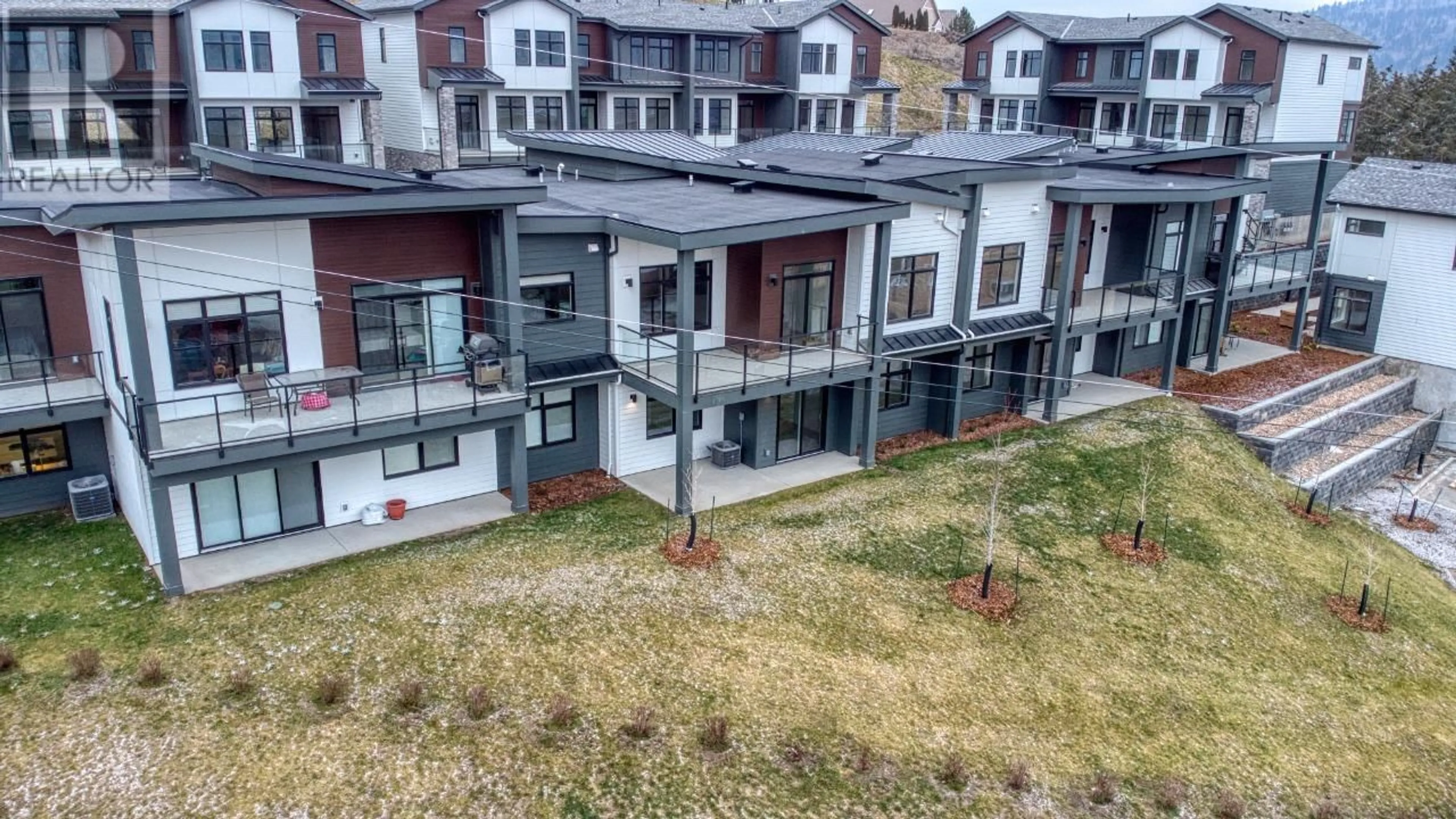 A pic from outside/outdoor area/front of a property/back of a property/a pic from drone, city buildings view from balcony for 7599 Klinger Road Unit# 13, Vernon British Columbia V1H1G9