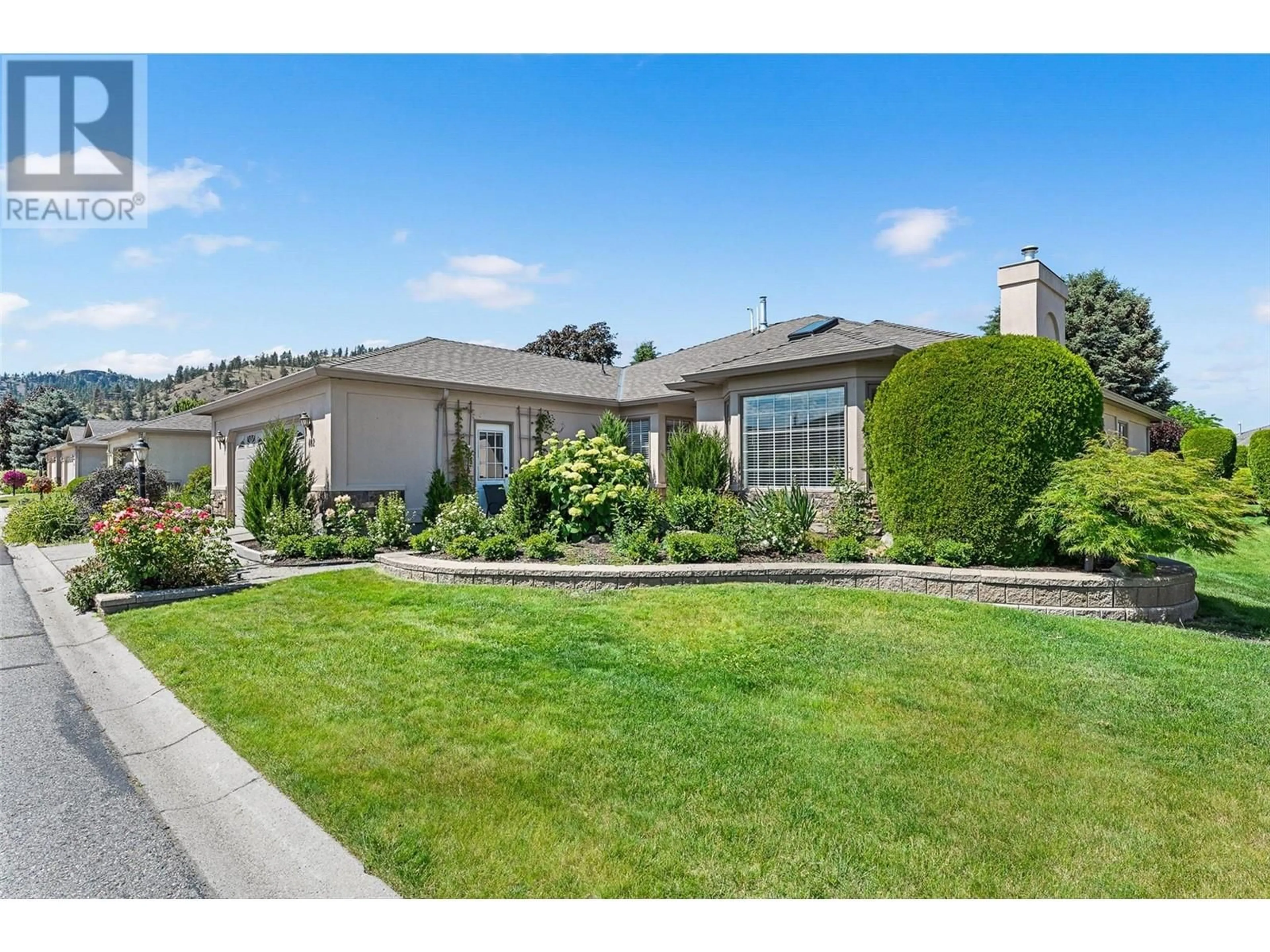 A pic from outside/outdoor area/front of a property/back of a property/a pic from drone, street for 402 - 595 YATES ROAD, Kelowna British Columbia V1V1P8