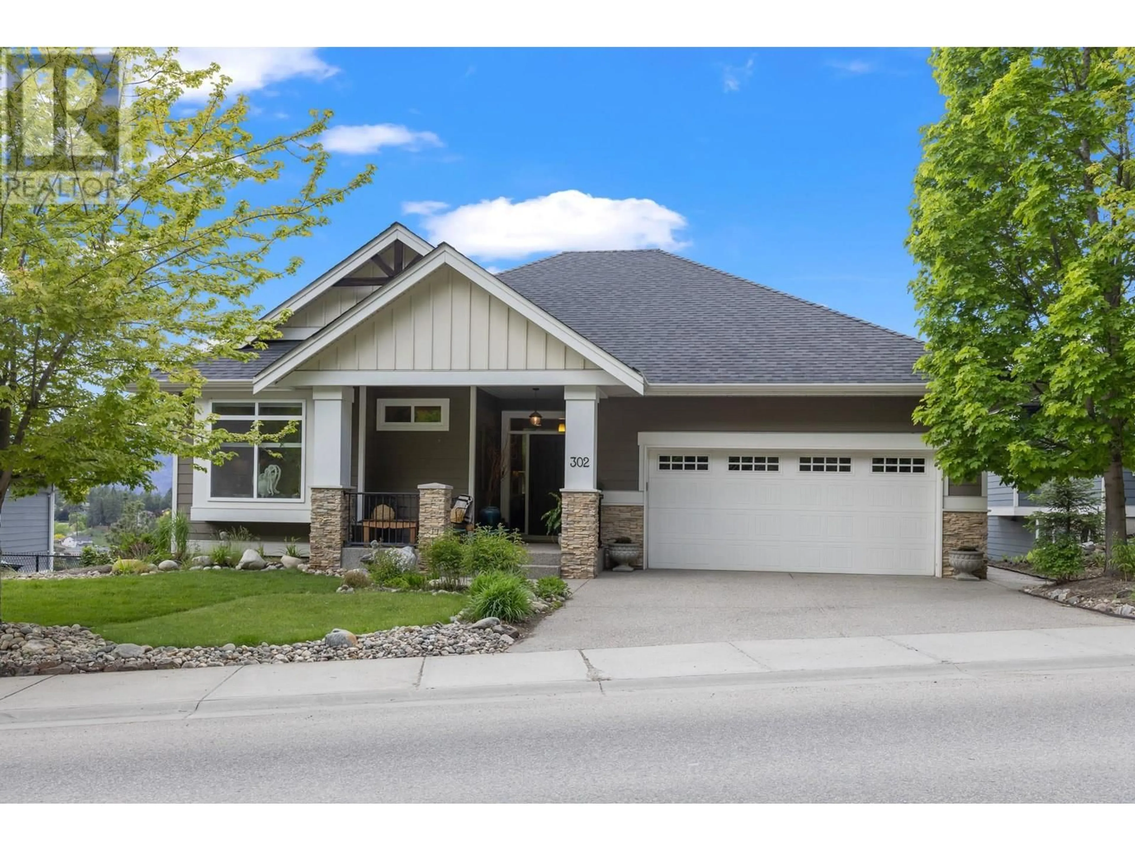 Home with vinyl exterior material, street for 302 Upper Canyon Drive, Kelowna British Columbia V1V2Z8