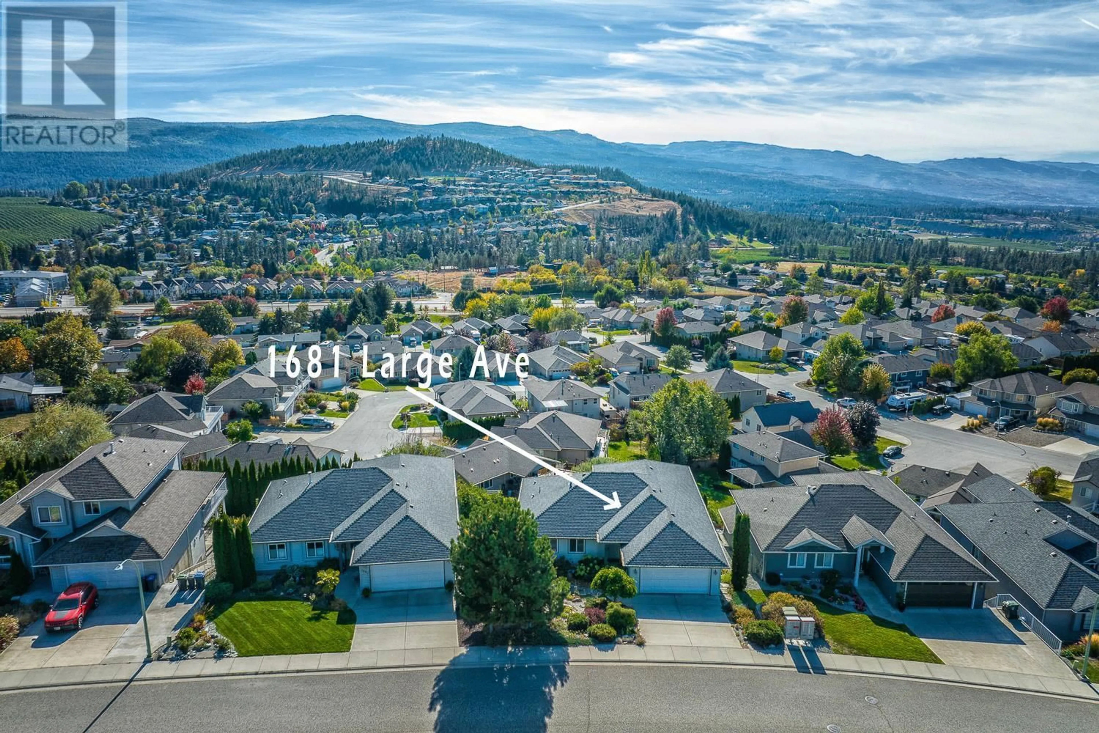 A pic from outside/outdoor area/front of a property/back of a property/a pic from drone, mountain view for 1681 Large Avenue, Kelowna British Columbia V1P1M9